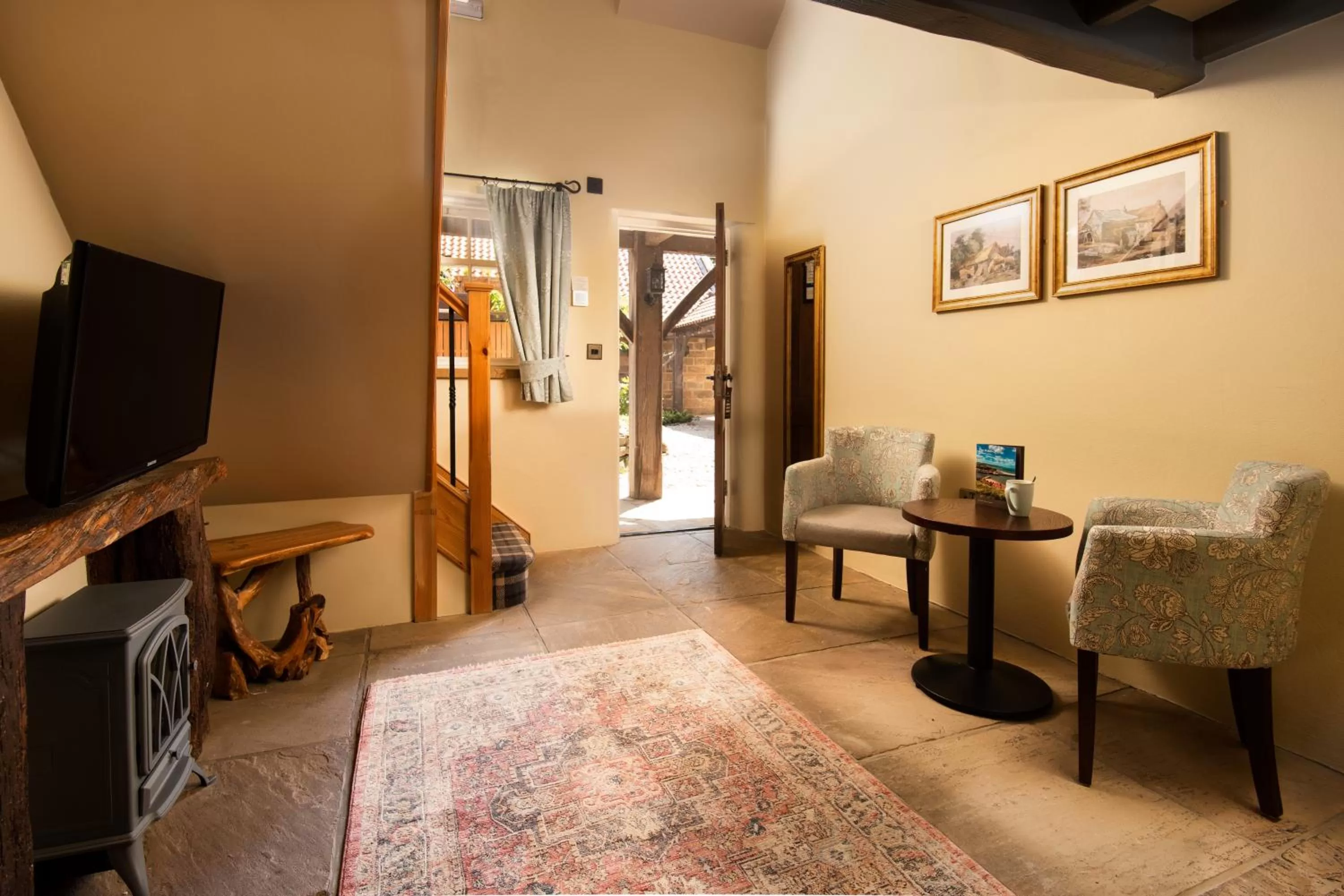 Seating area, TV/Entertainment Center in The Stables - The Inn Collection Group