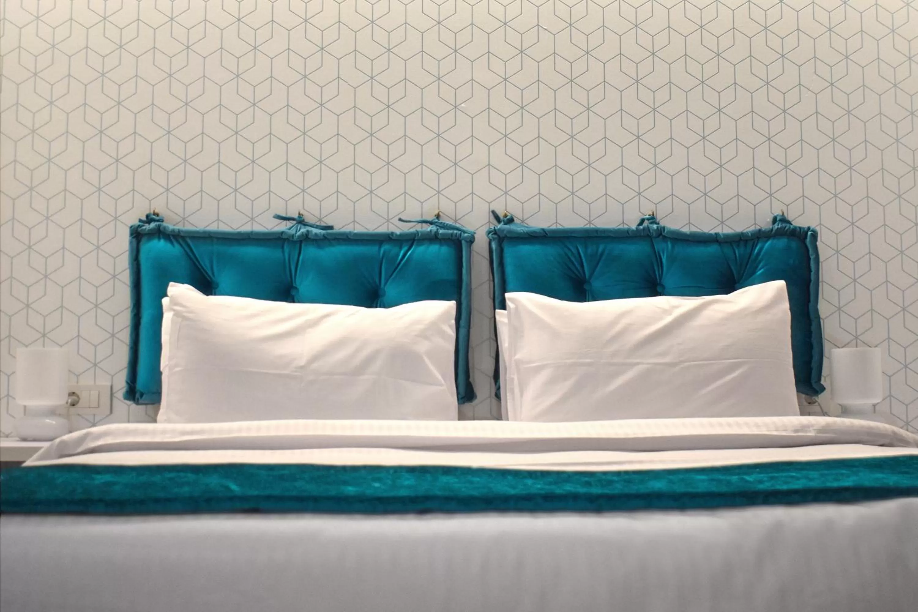 Bed in Athenian Montaza Hotel