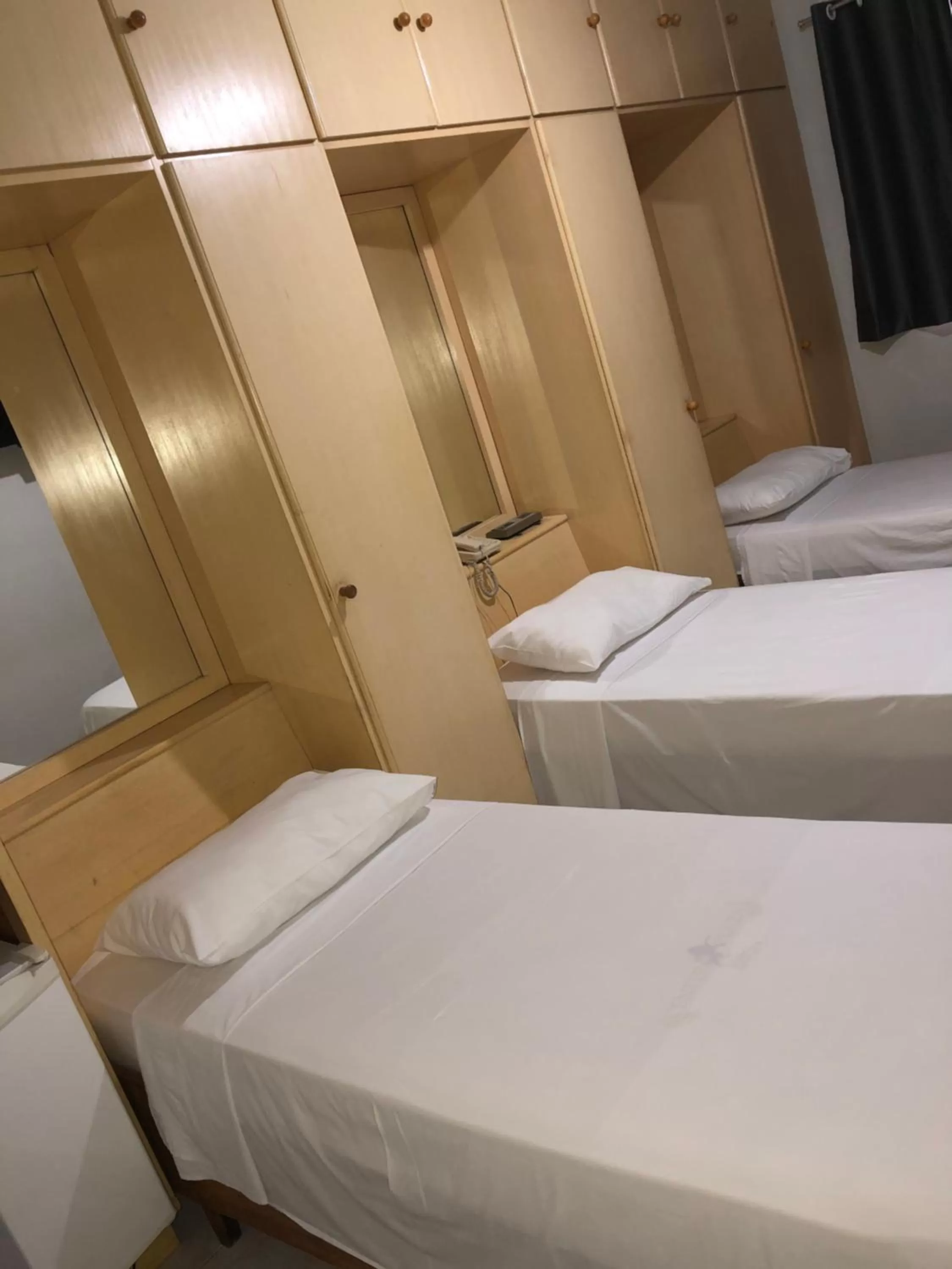 Bed in Center Plaza Hotel