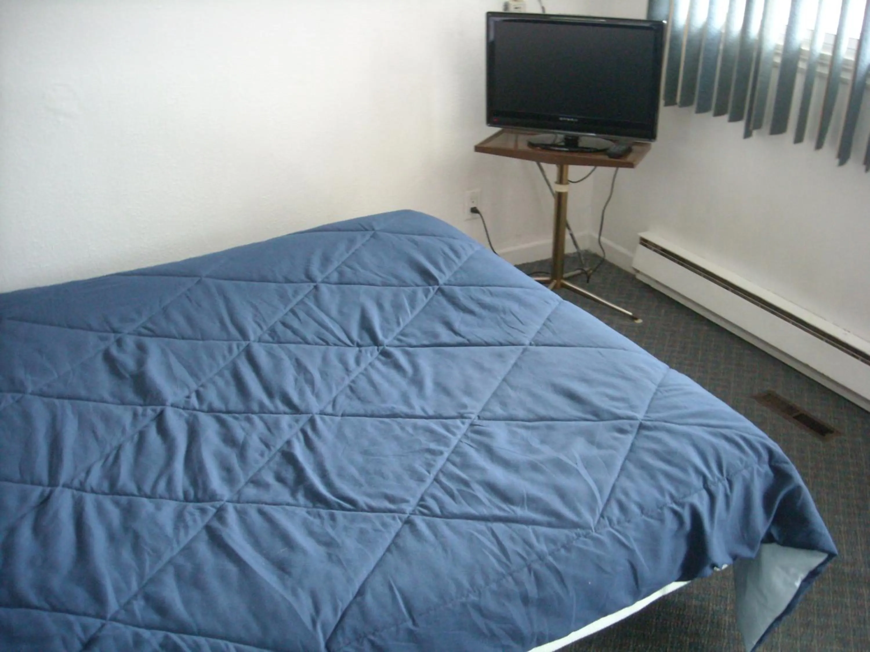 Bed in Motel le Verseau