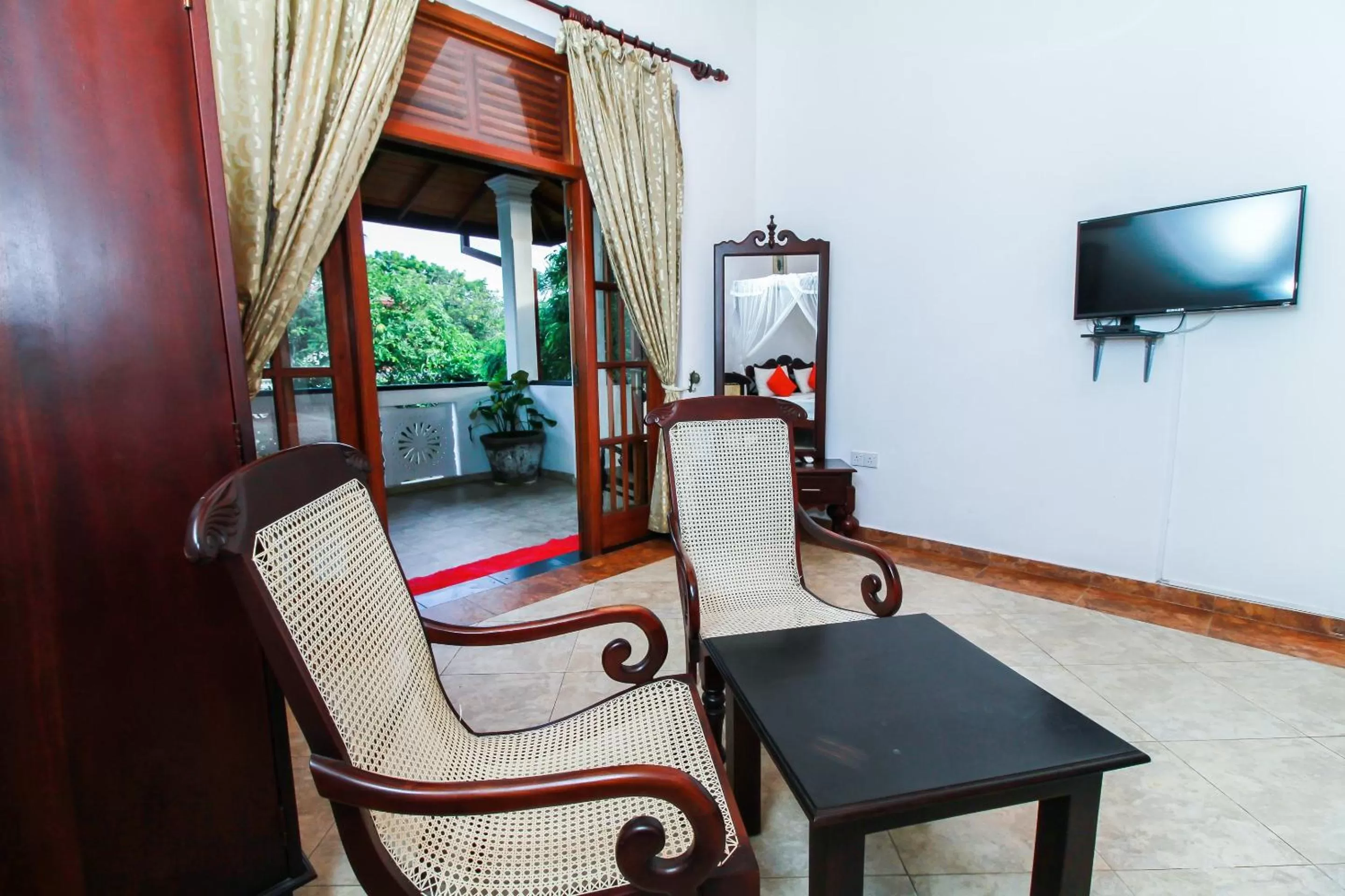 Bedroom, Seating Area in Chami Villa Bentota