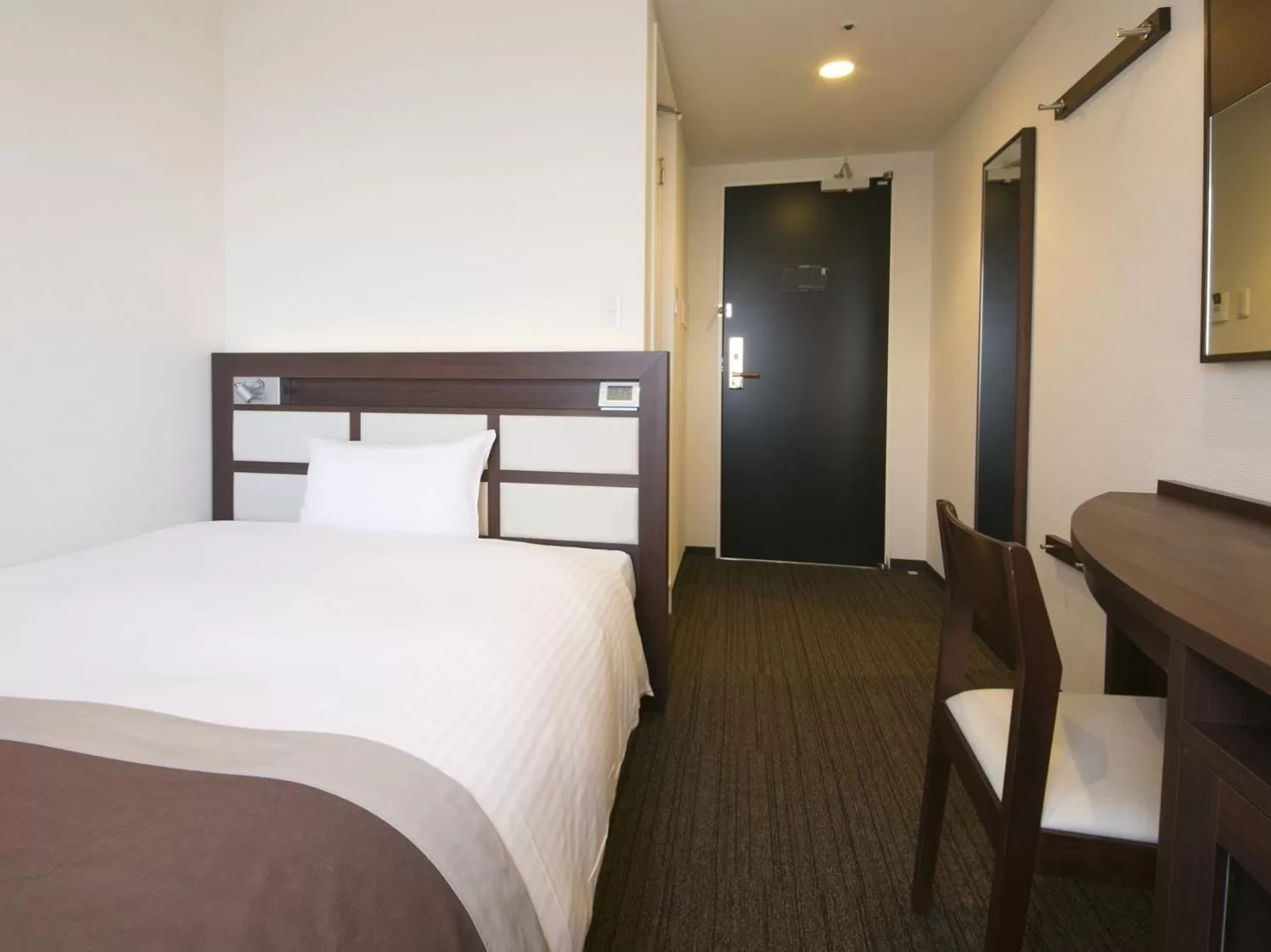 Bed in Urban Hotel Minami Kusatsu