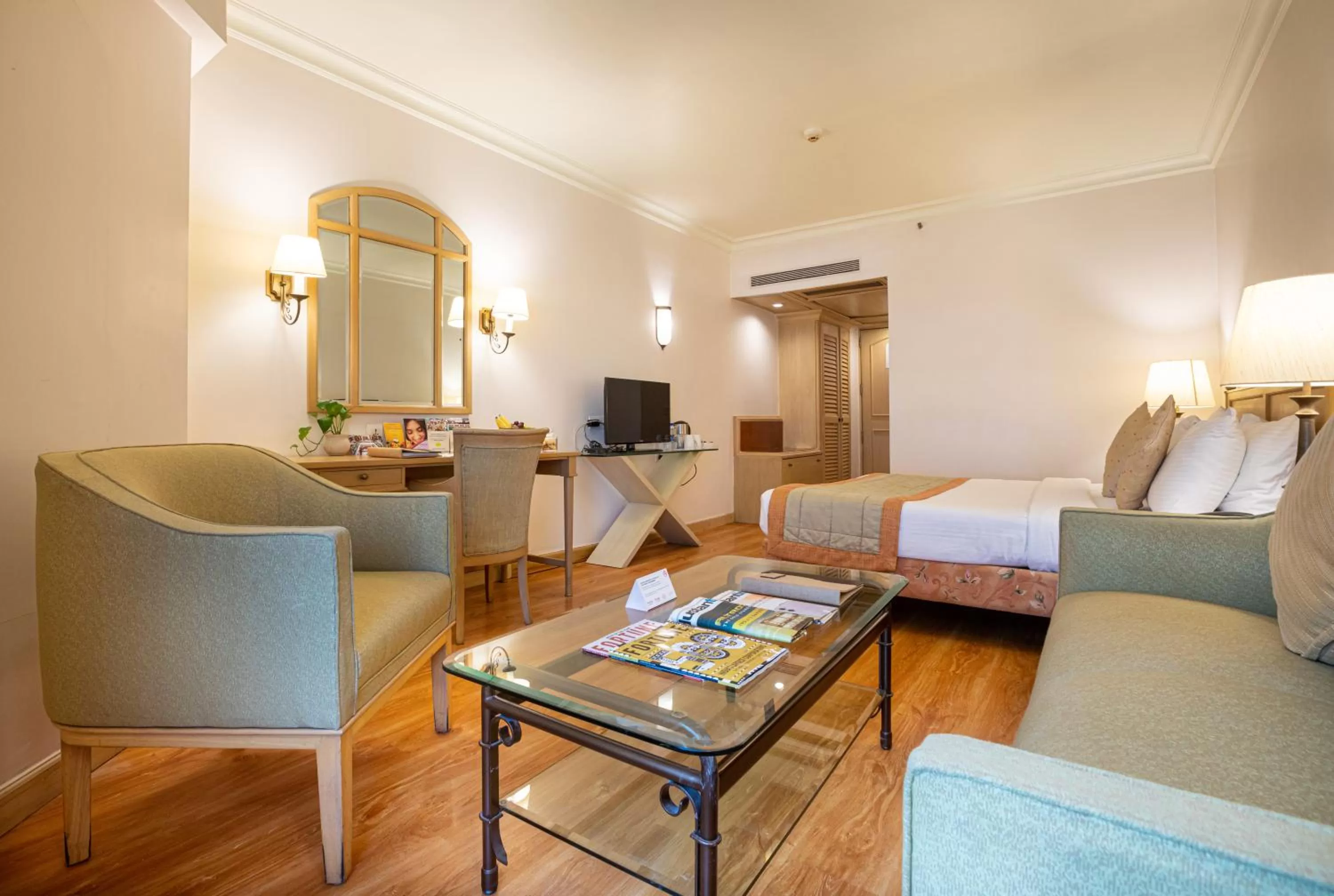 Living room, Bed in The Orchid Hotel Mumbai Vile Parle