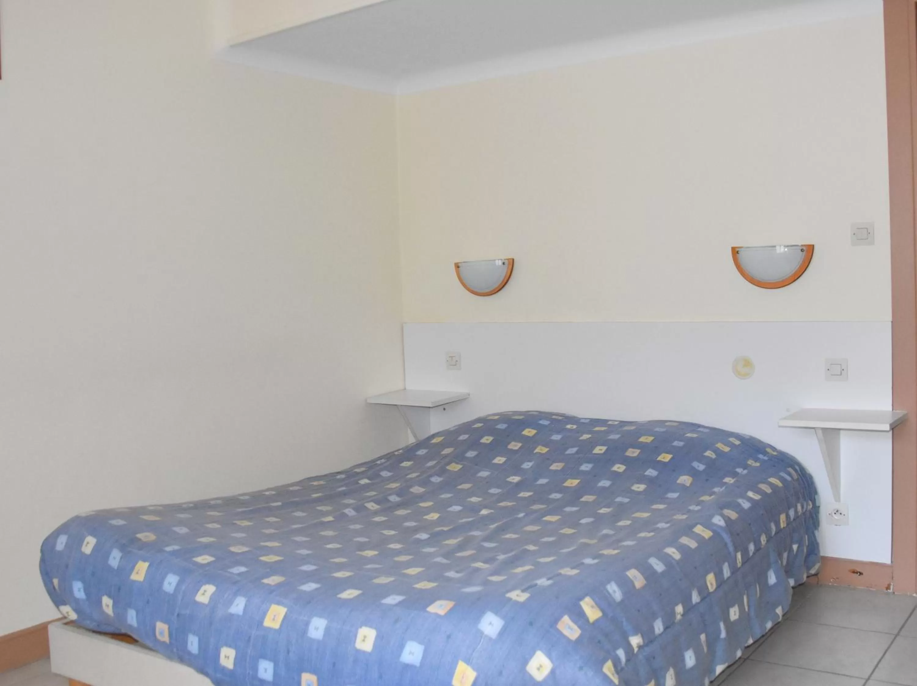 Bed in Hotel Gai Relais