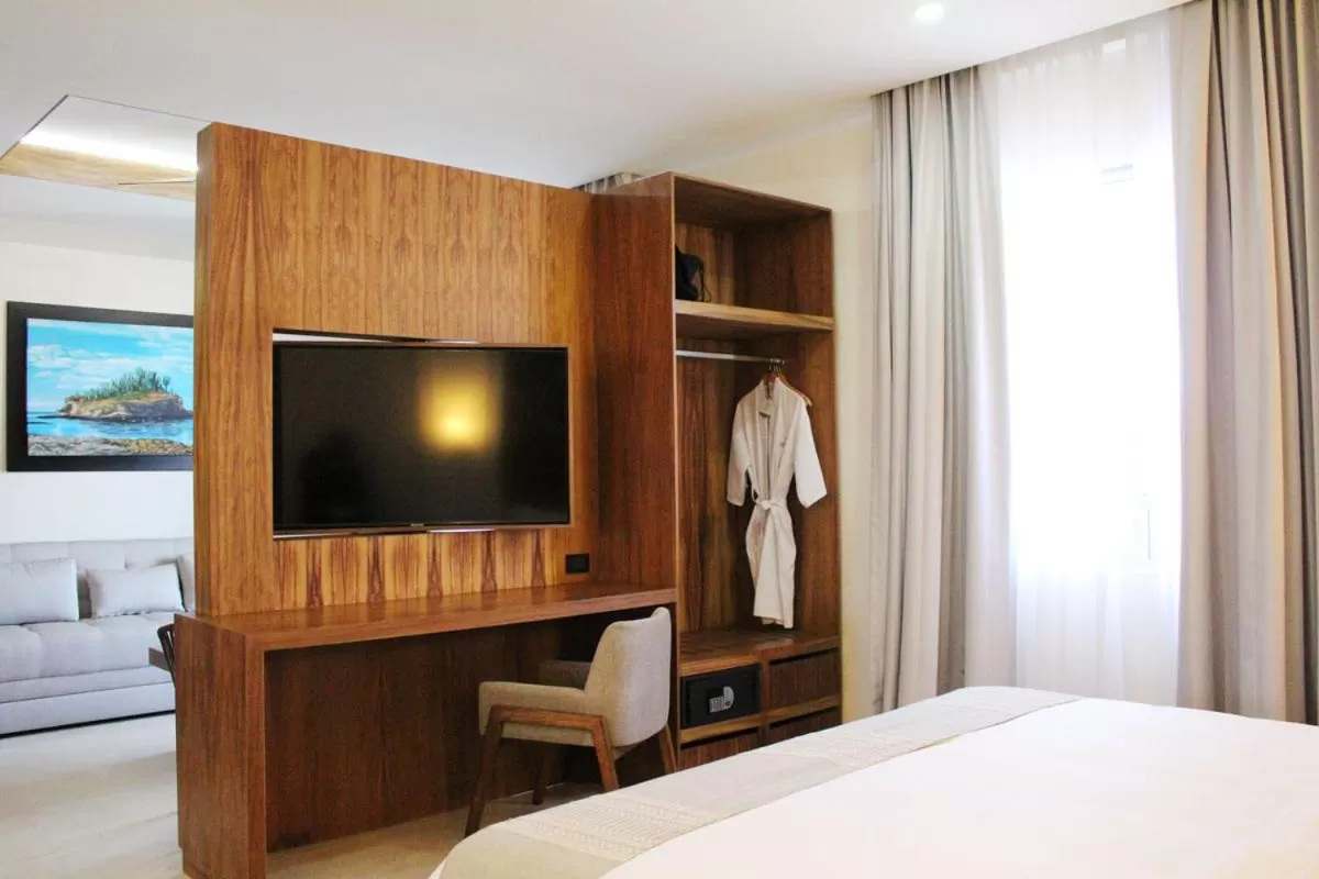 Communal lounge/ TV room, Bed in Casa Maria Boutique Hotel