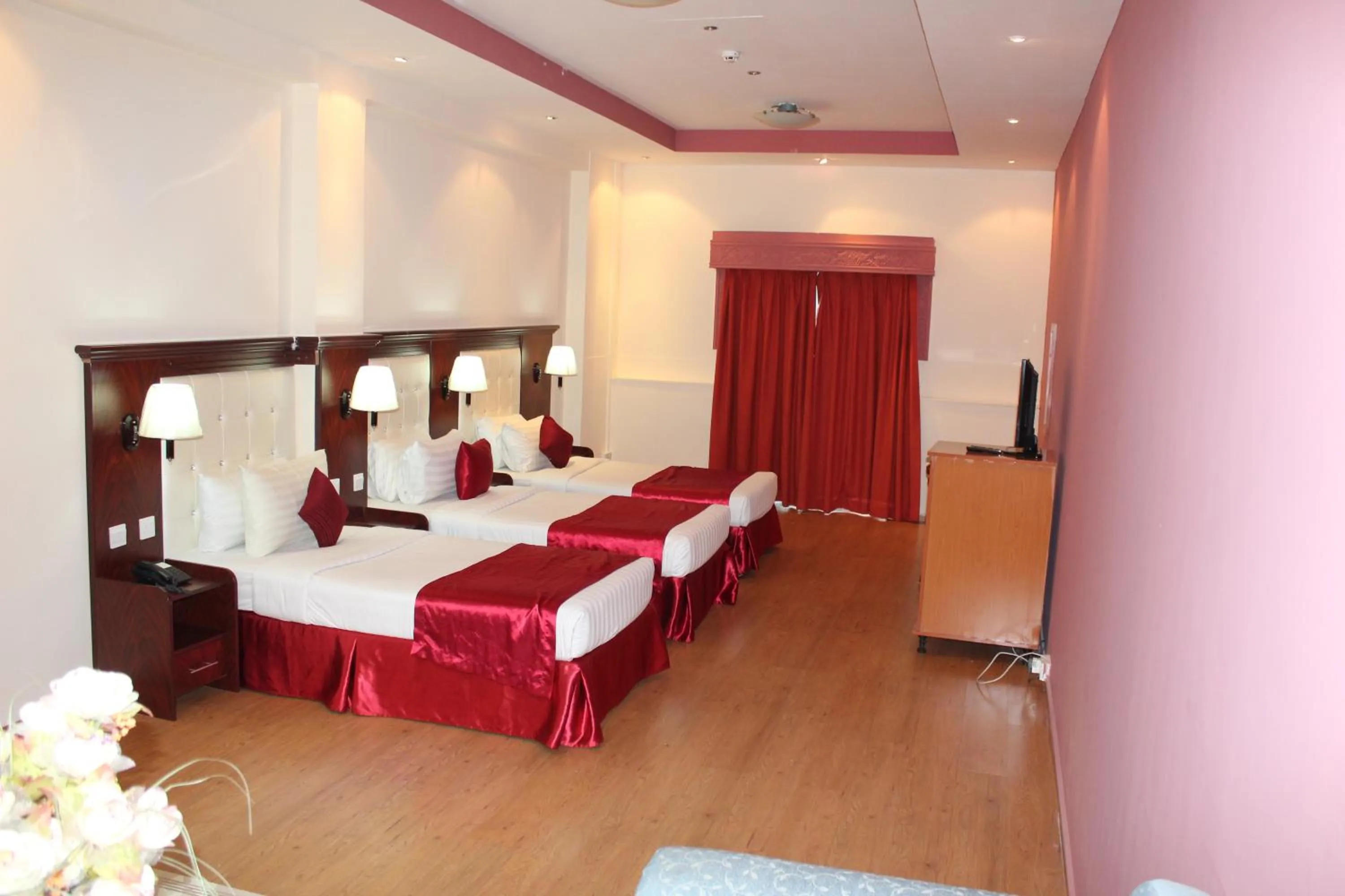 Bed in Grand Nova Hotel