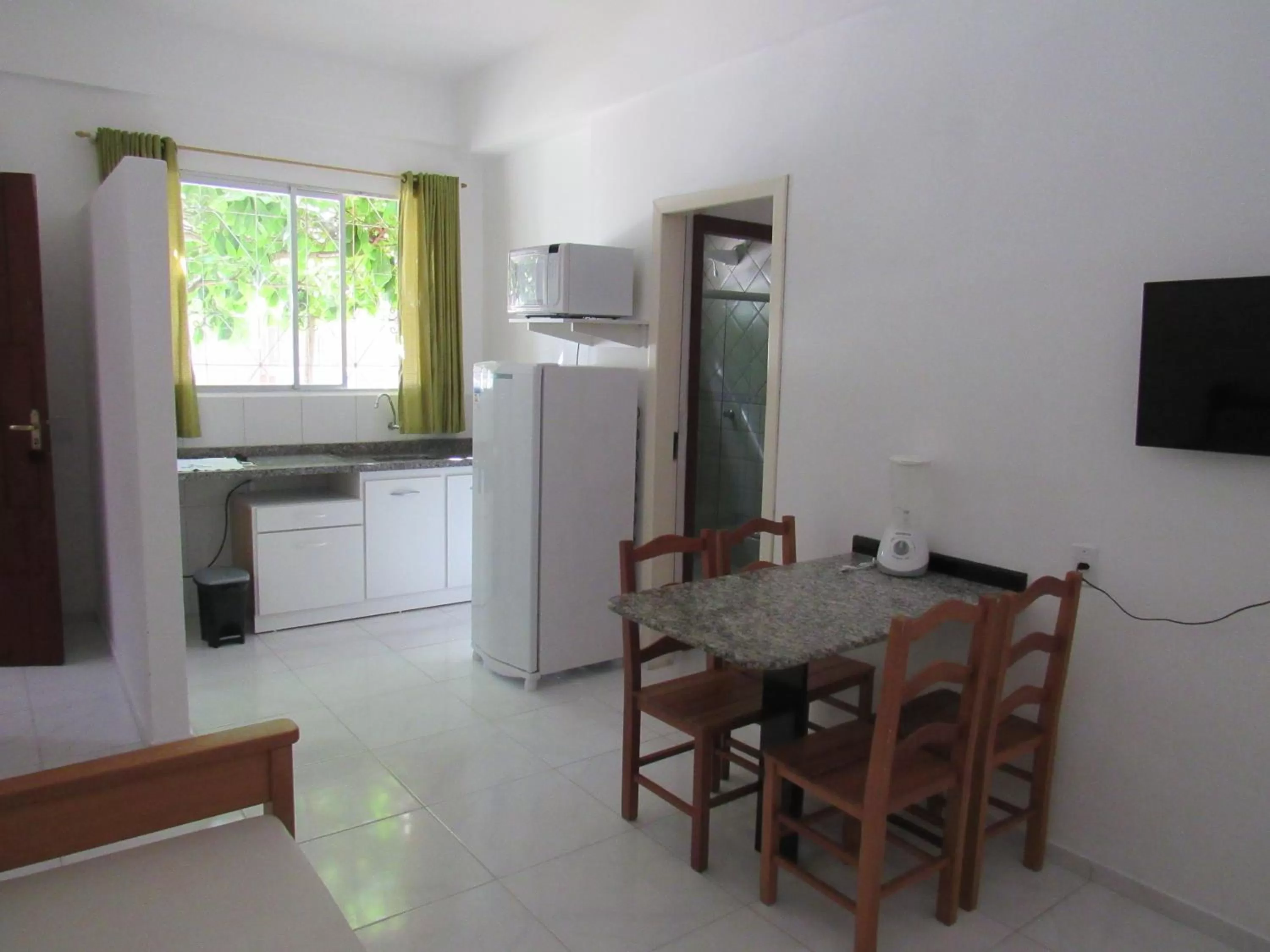 Kitchen or kitchenette in Pousada Recanto da Barra