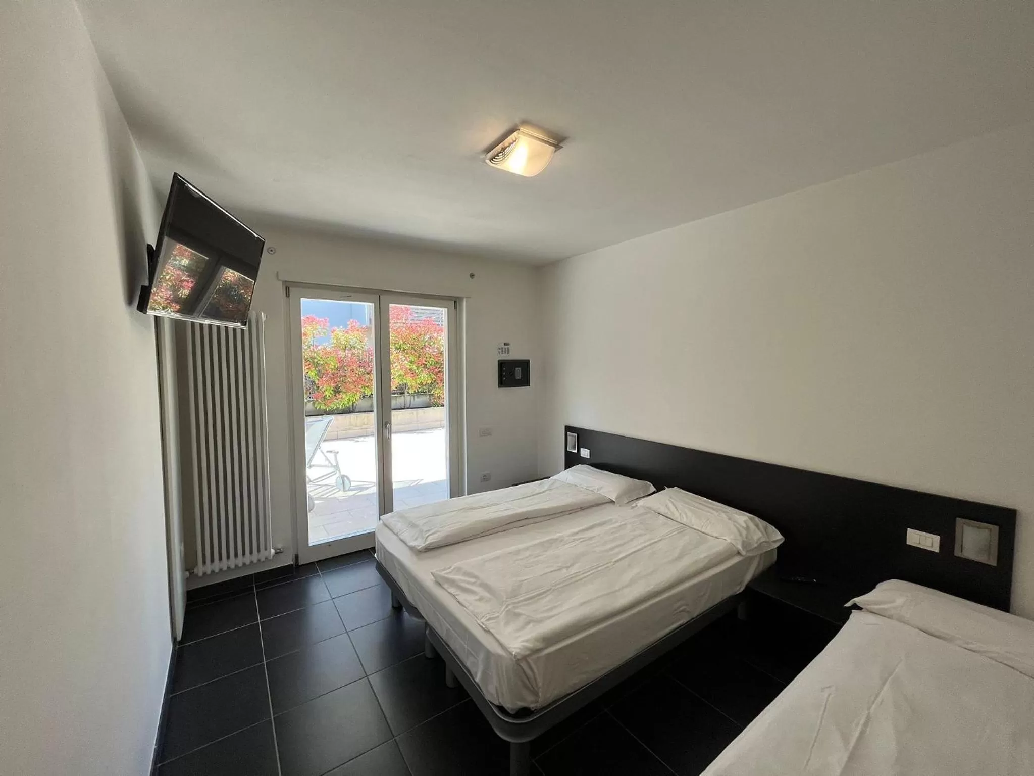 Bed in 4 Limoni Apartment Resort