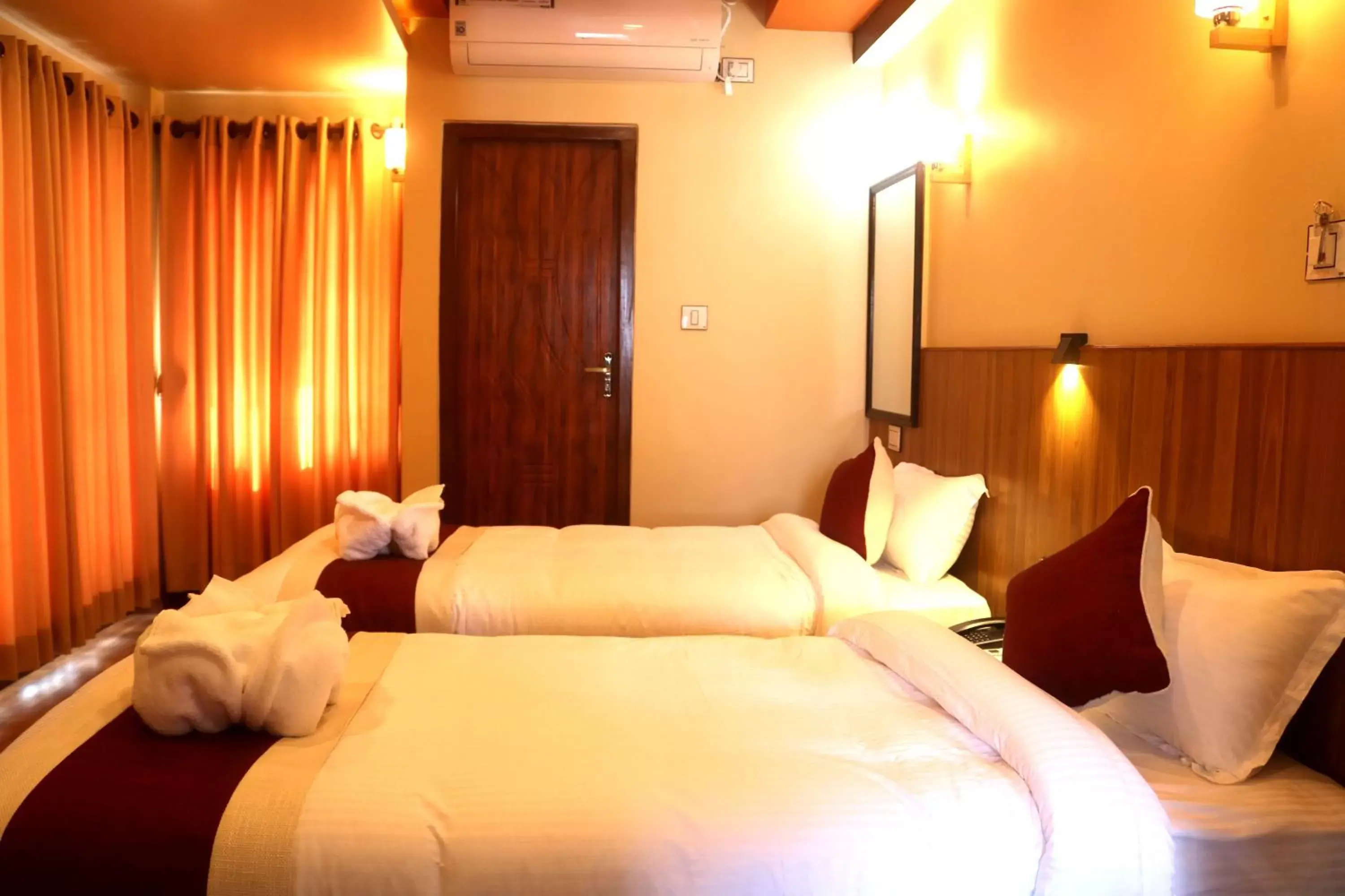 Quadruple Room with Balcony in Hotel Family Ties Pvt. Ltd. Quadruple Room with Balcony in Hotel Family Ties Pvt. Ltd.