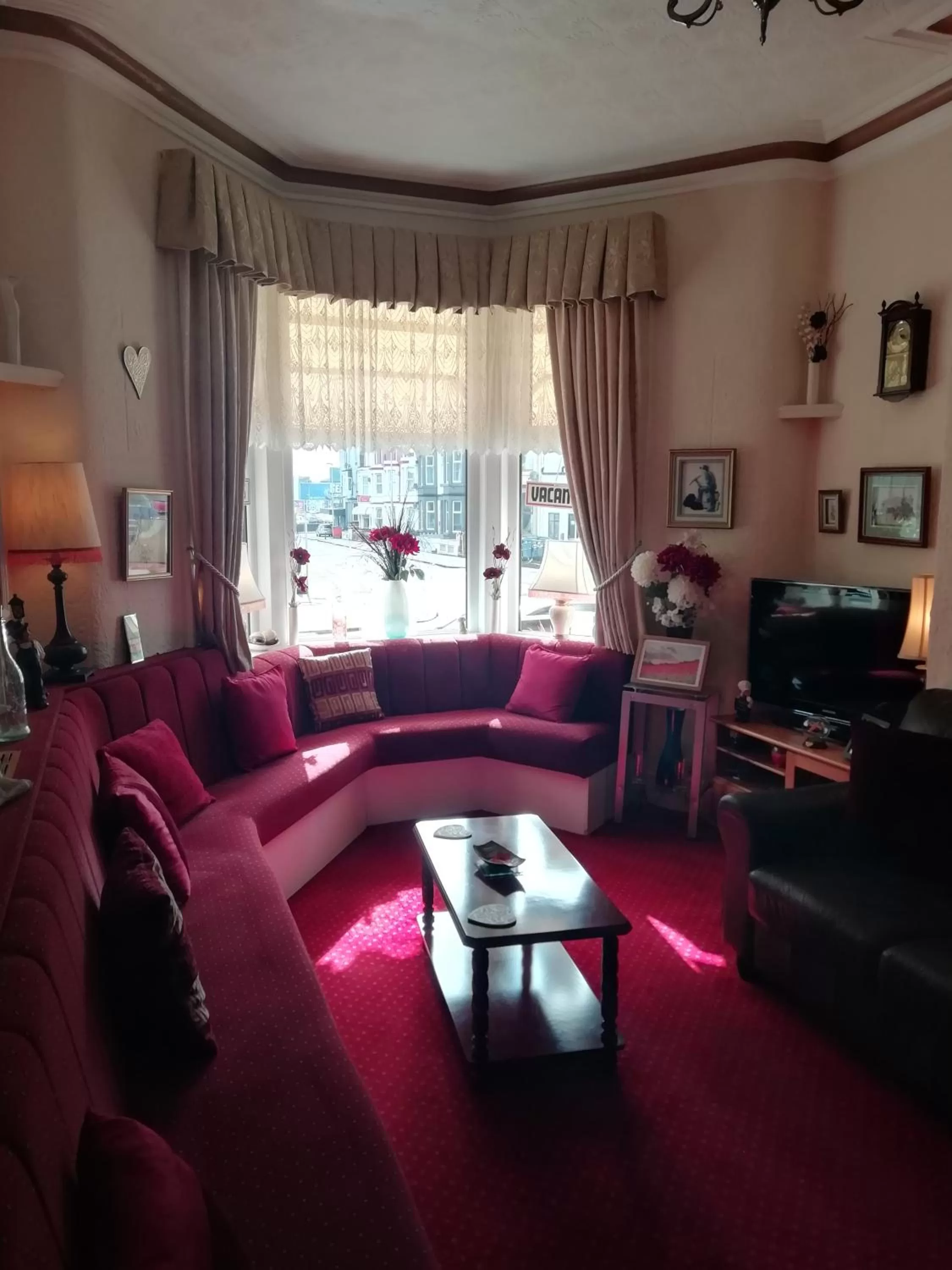 Communal lounge/ TV room in Shirley Heights Hotel