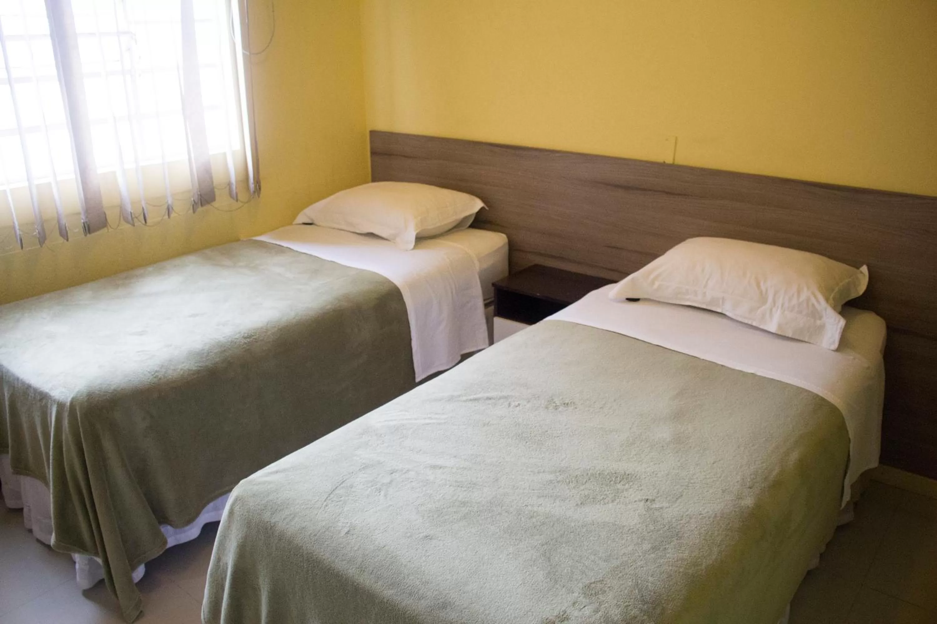 Bed in Hotel Dois Irmãos