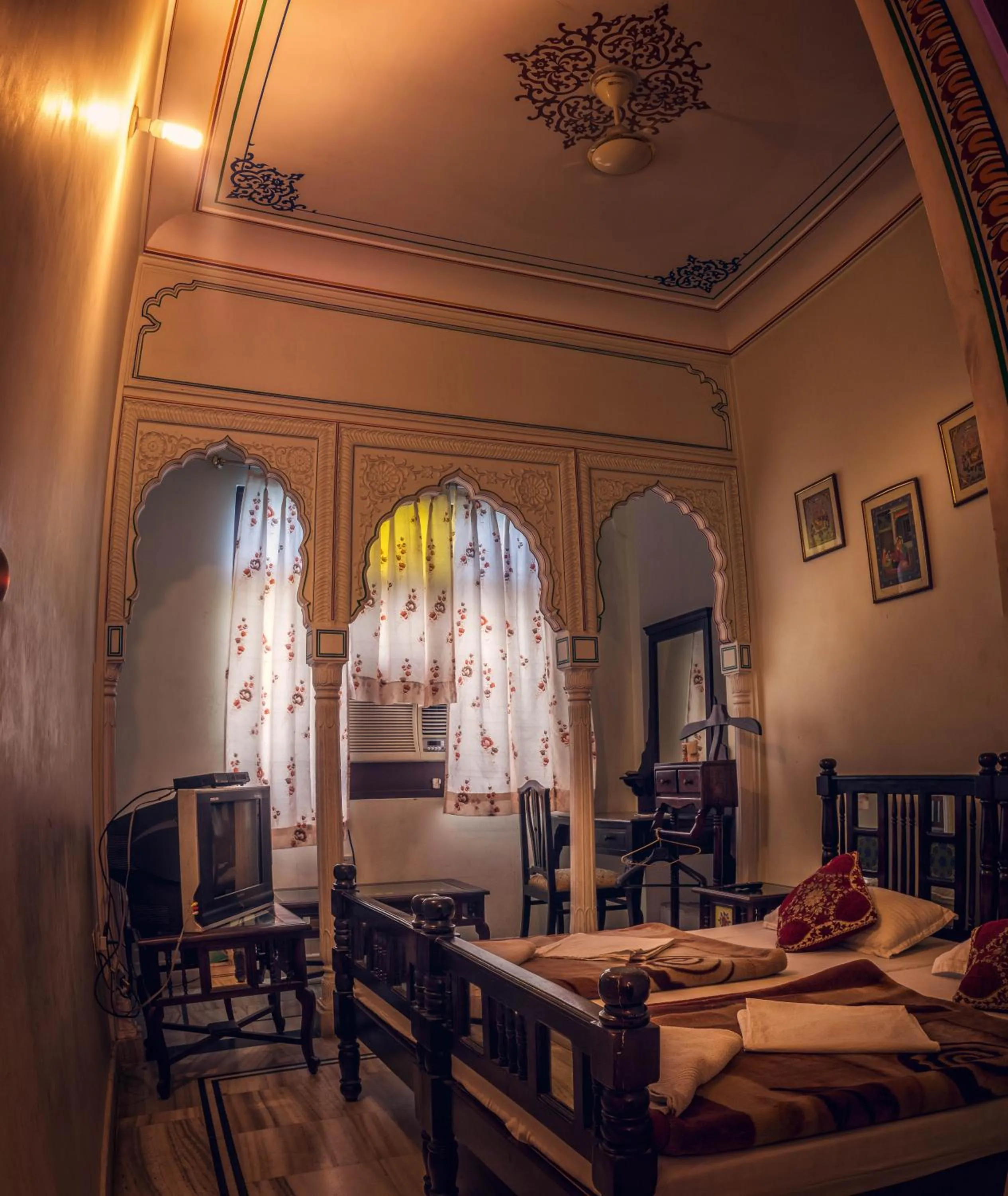 Bed in Krishna Palace - A Heritage Boutique Hotel