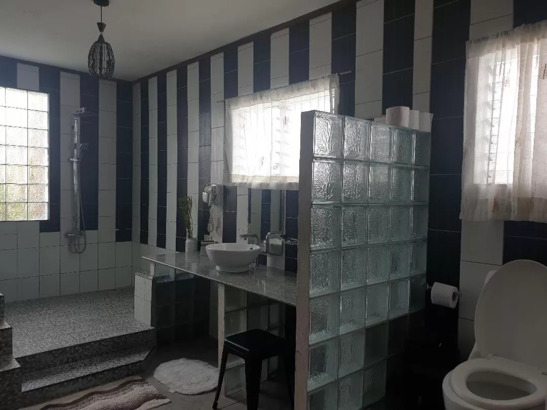 Toilet in TipTop Hotel, Resto and Delishop