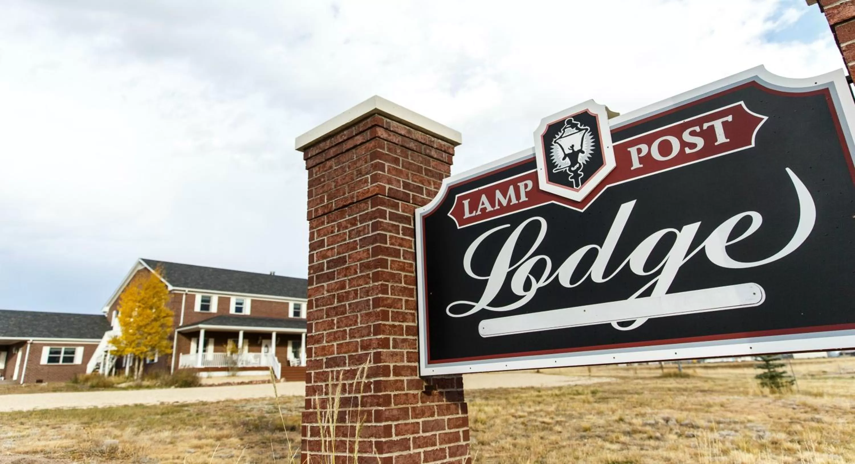 Property Logo/Sign in Lamp Post Lodge