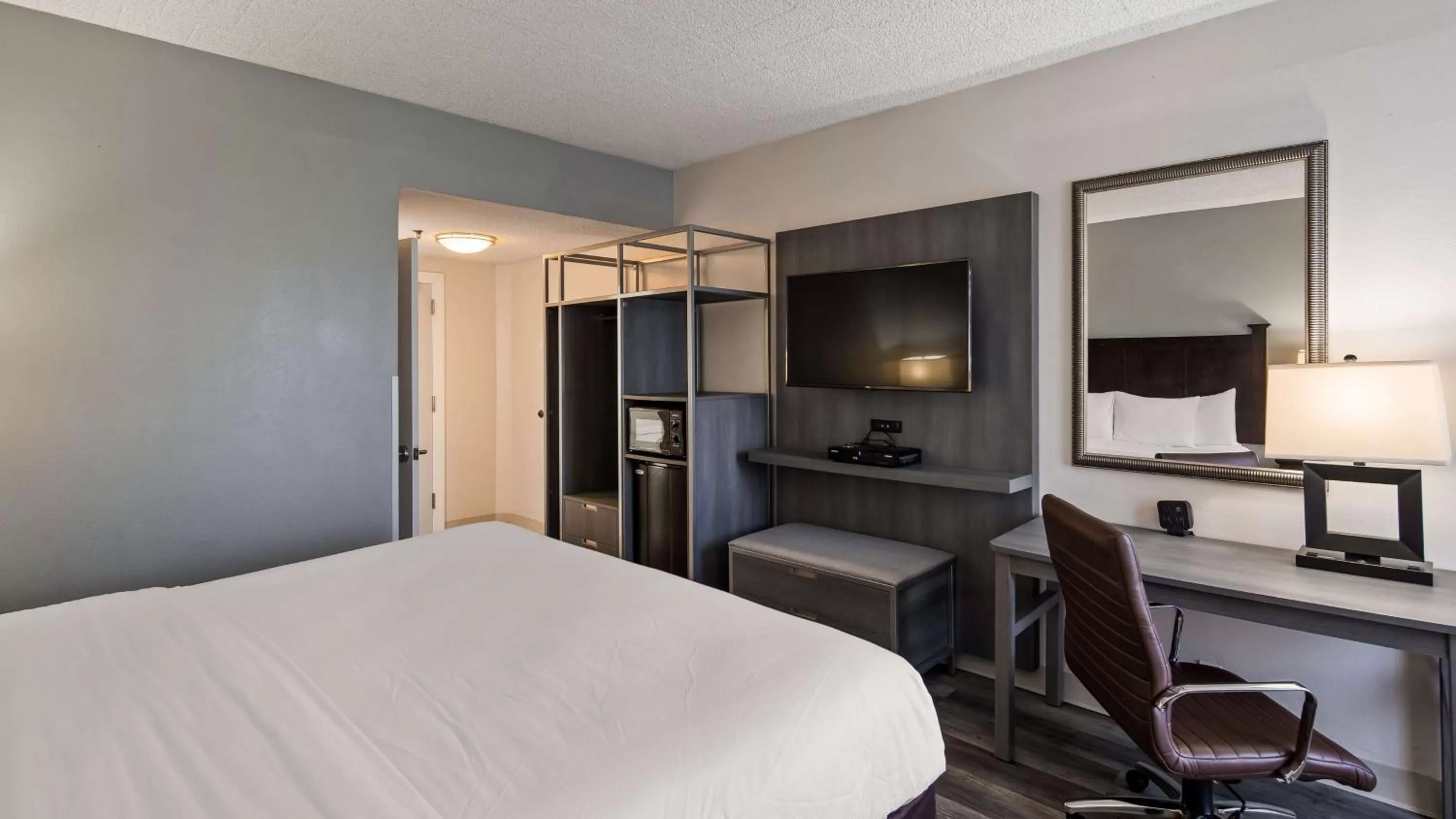 Photo of the whole room, TV/Entertainment Center in Best Western Paramus Hotel & Suites