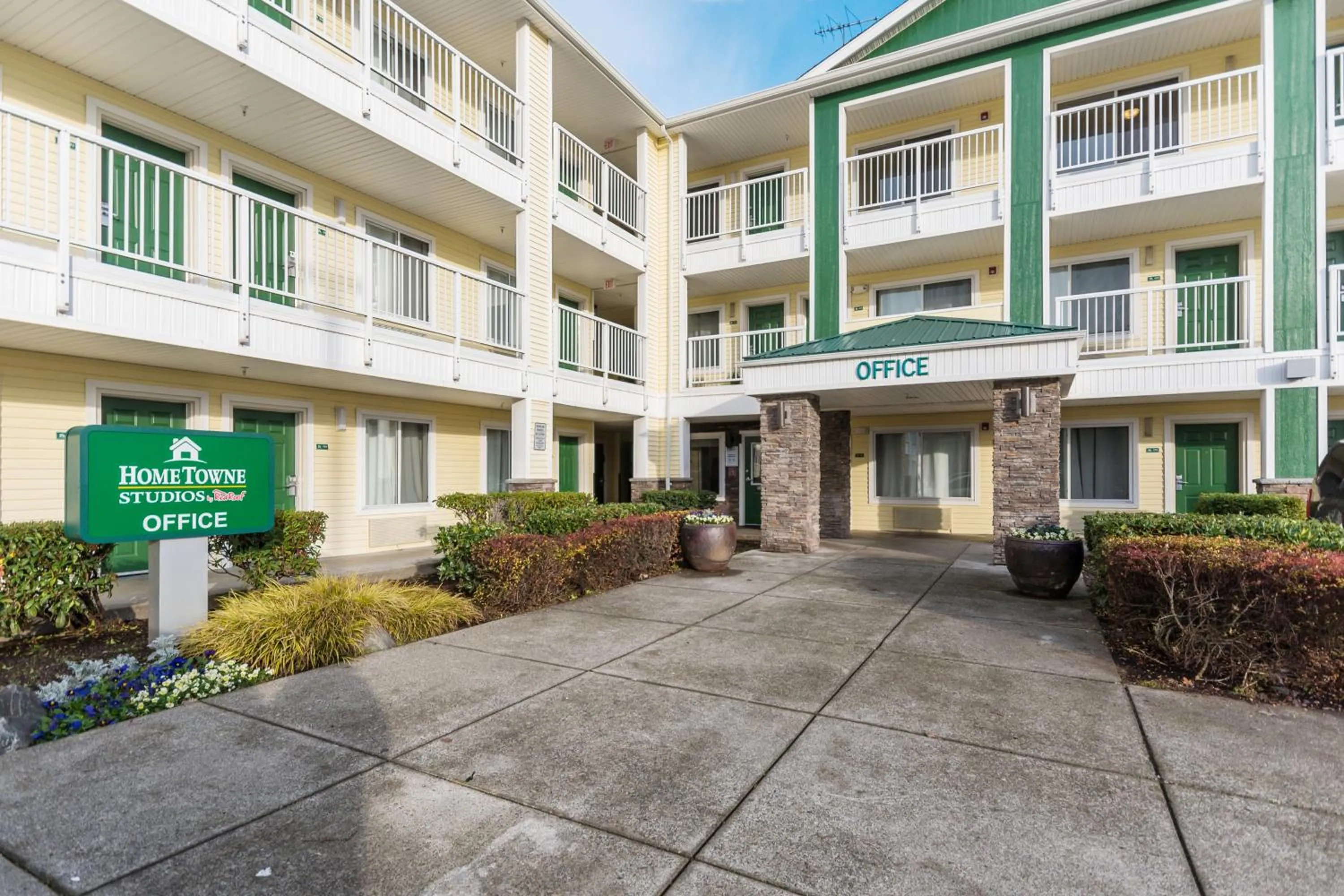 Property building in HomeTowne Studios by Red Roof Seattle - Kent/Des Moines