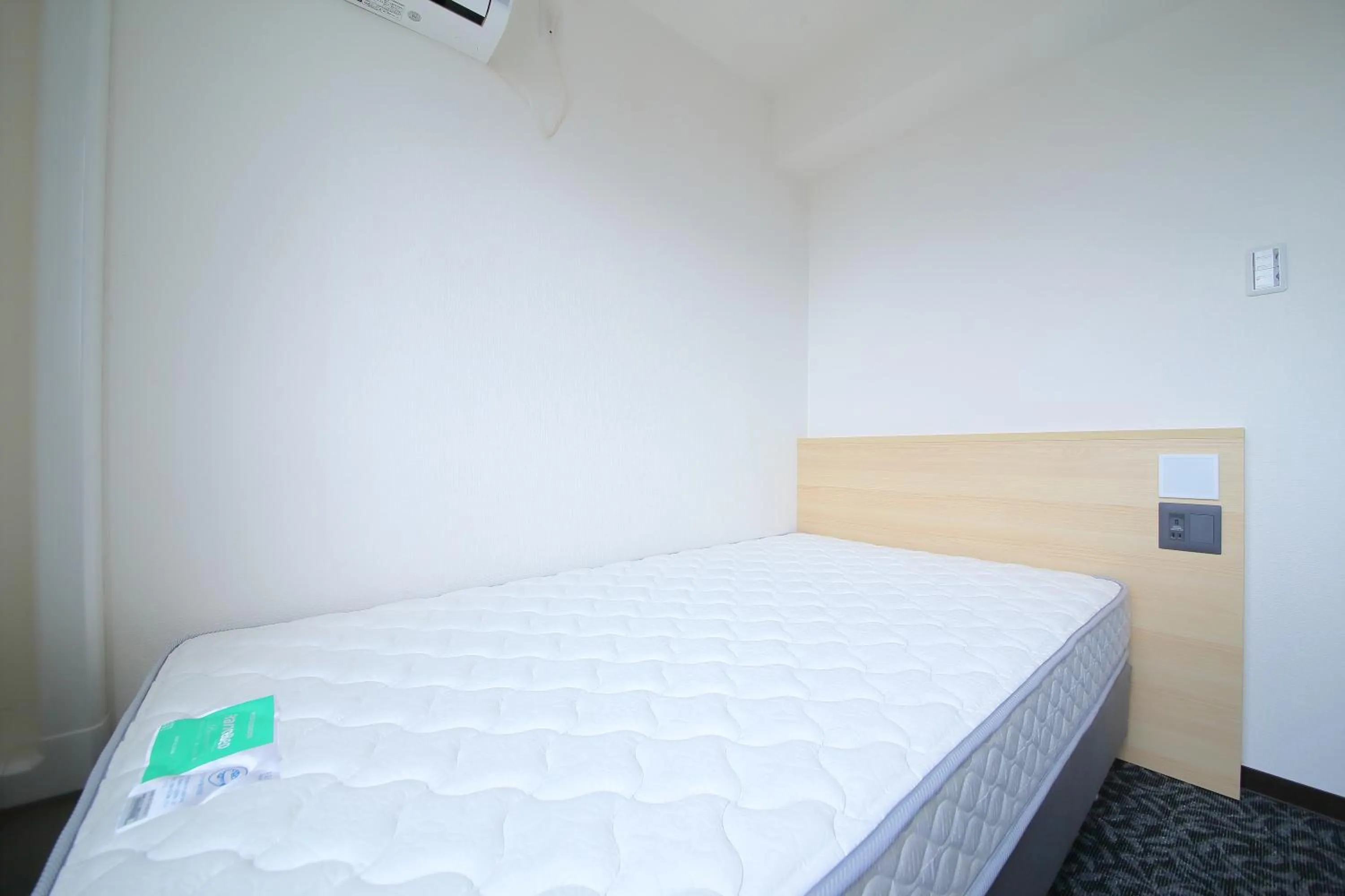 Bed in Hotel Shin-Imamiya