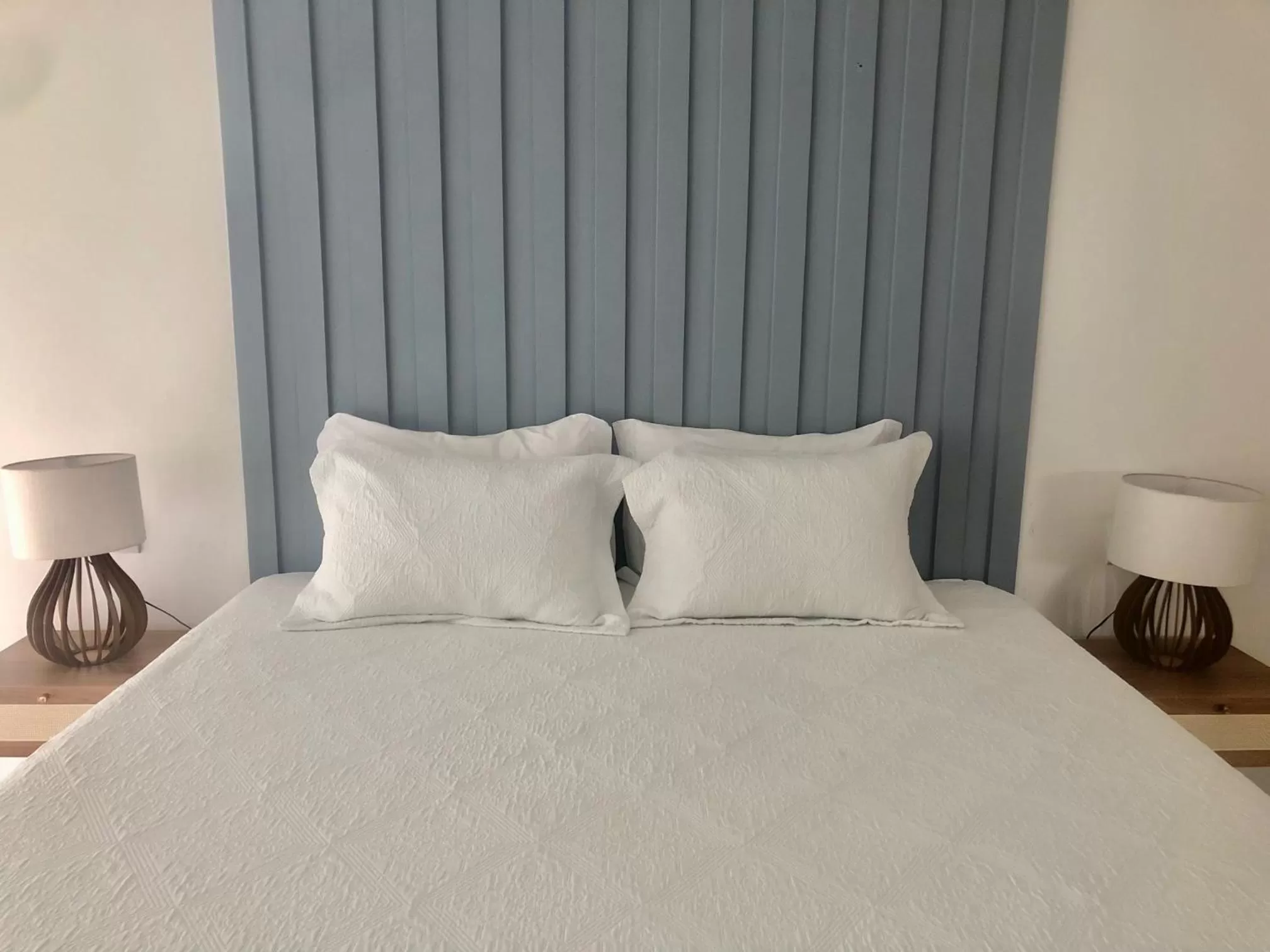 Bed in Guest House Guarujá