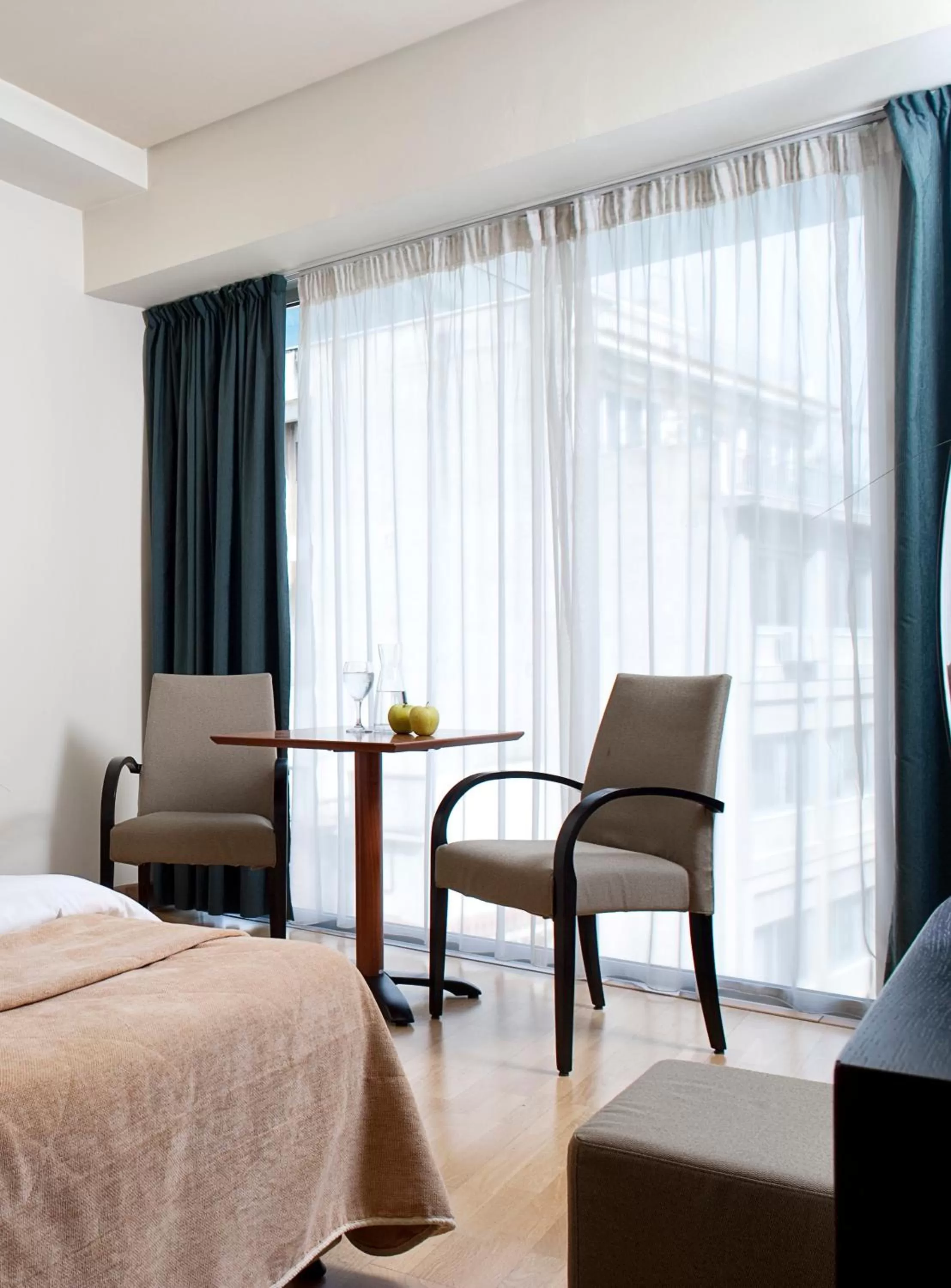 Seating area, Bed in Arion Athens Hotel