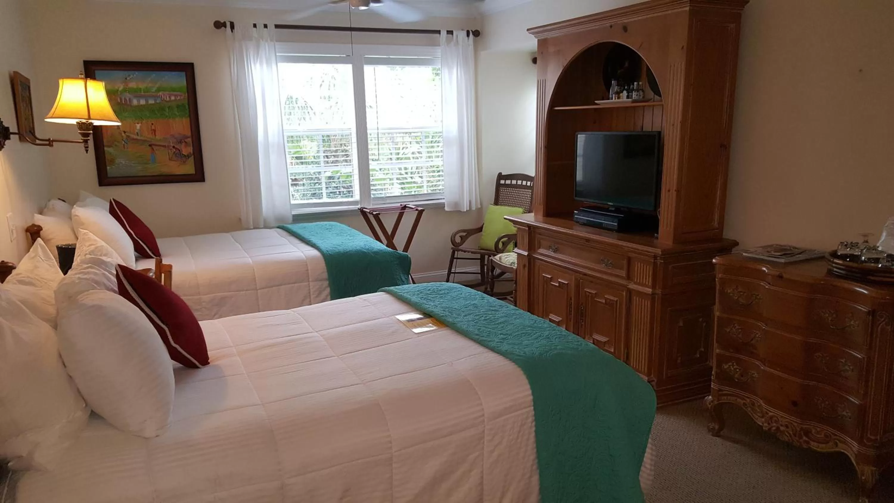 Bedroom, Bed in The Caribbean Court Boutique Hotel