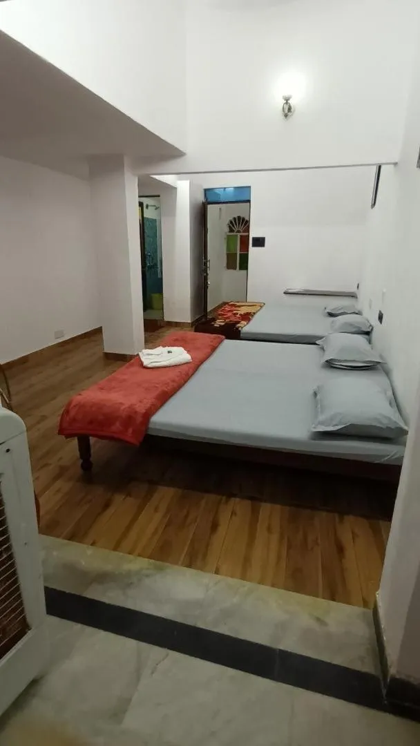 Photo of the whole room, Bed in Jag Niwas Guest House & pure veg restaurant