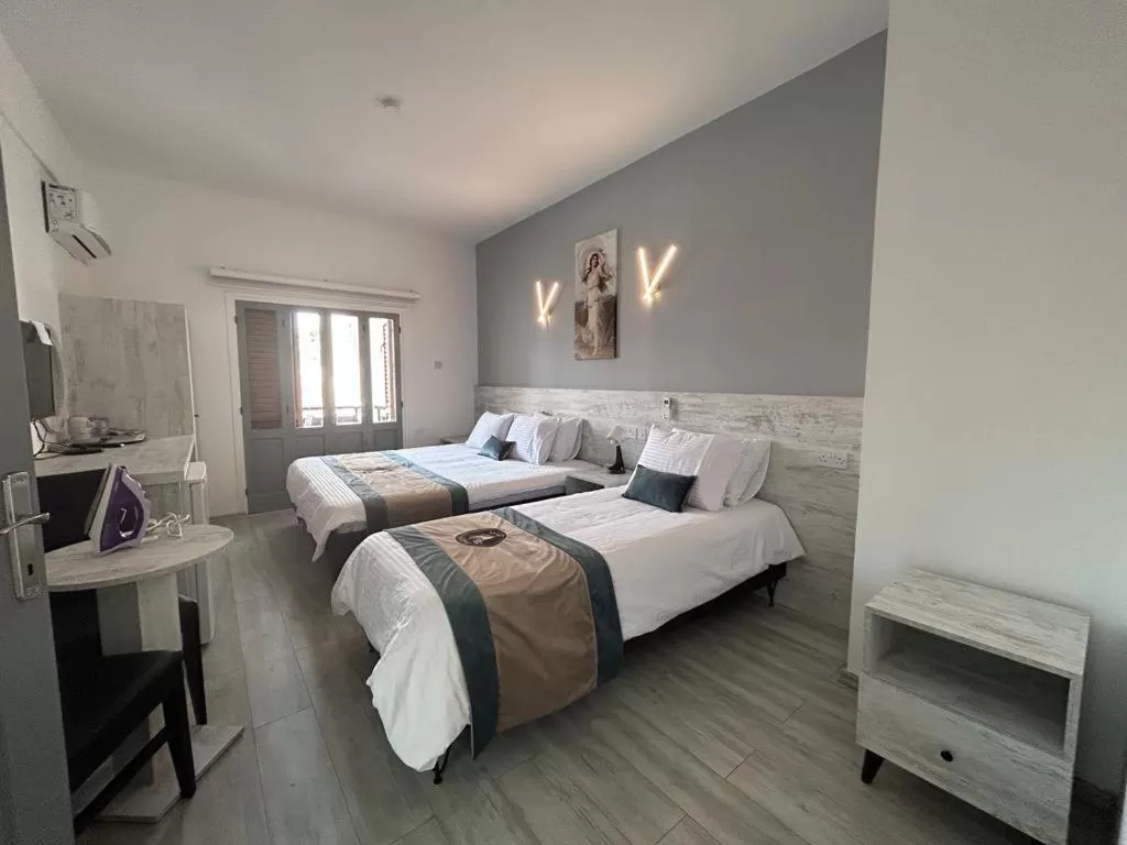 Bed in Royal Goddess Guest House, Walled City