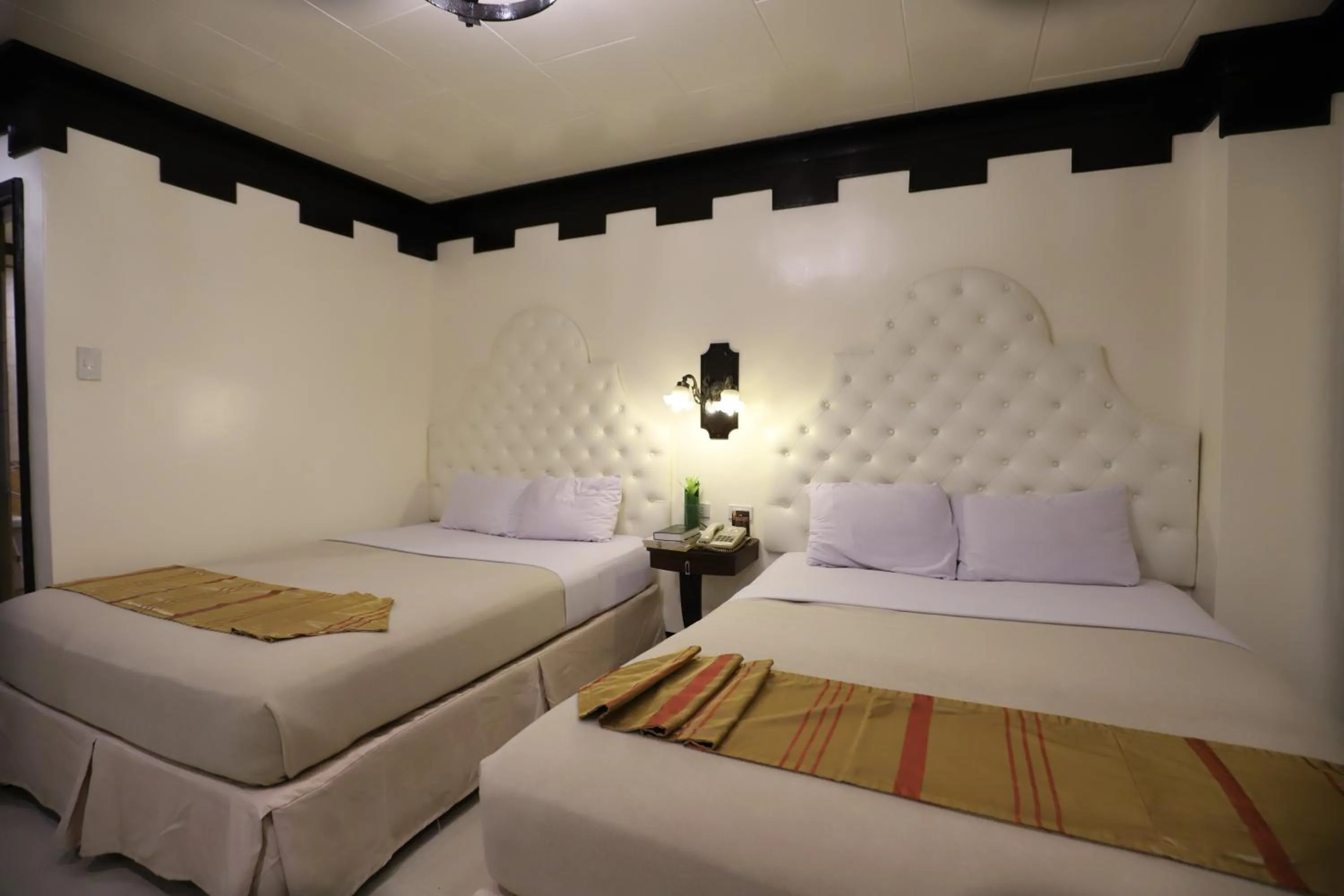 Bed in Camelot Hotel