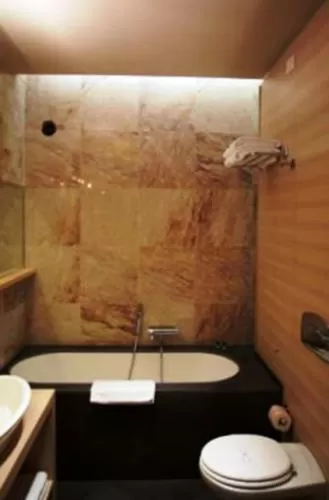 Bathroom in El Homs Palace Hotel