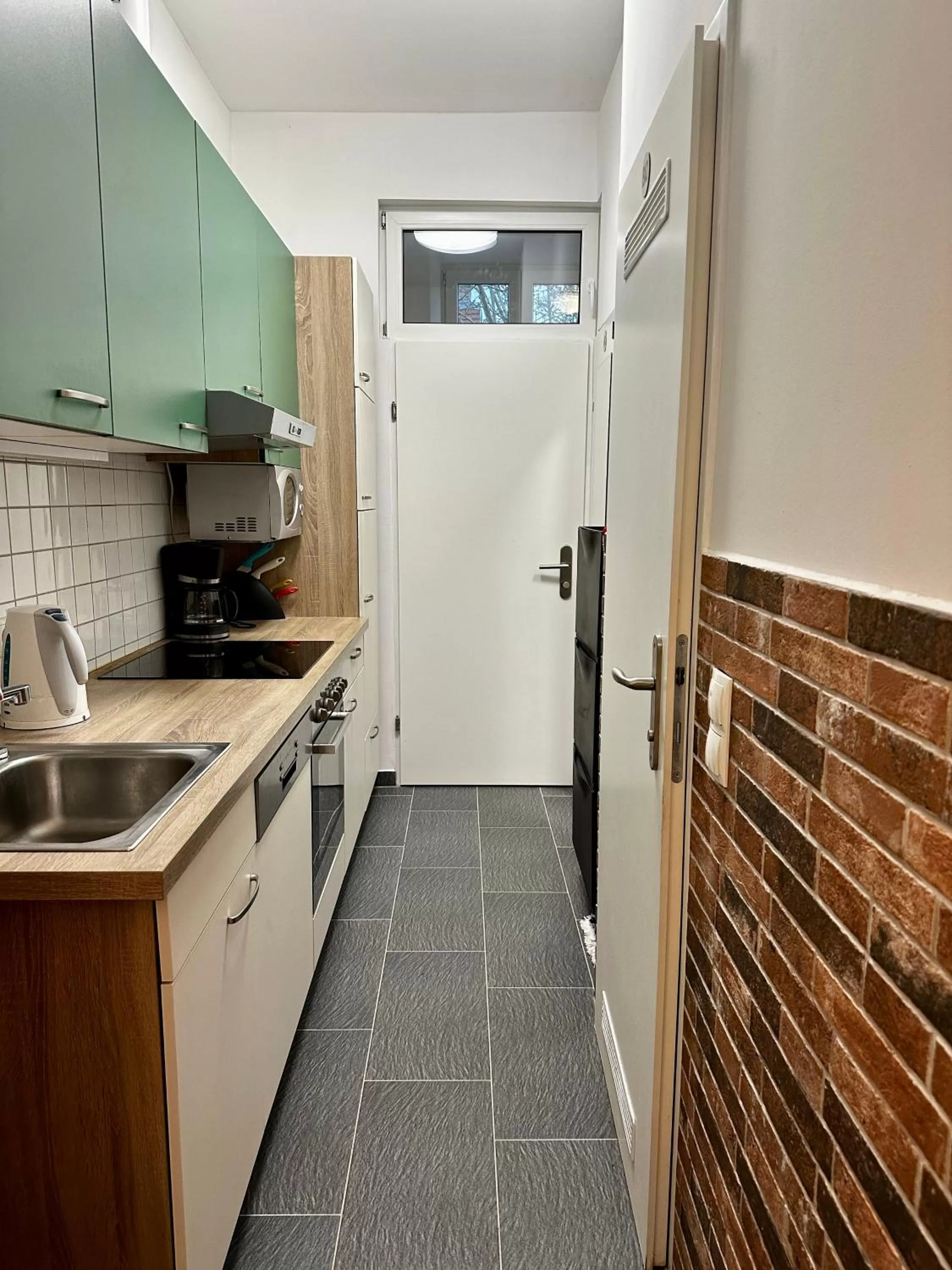 kitchen in AJO Apartments - Messe City Flat - Self-Check-in