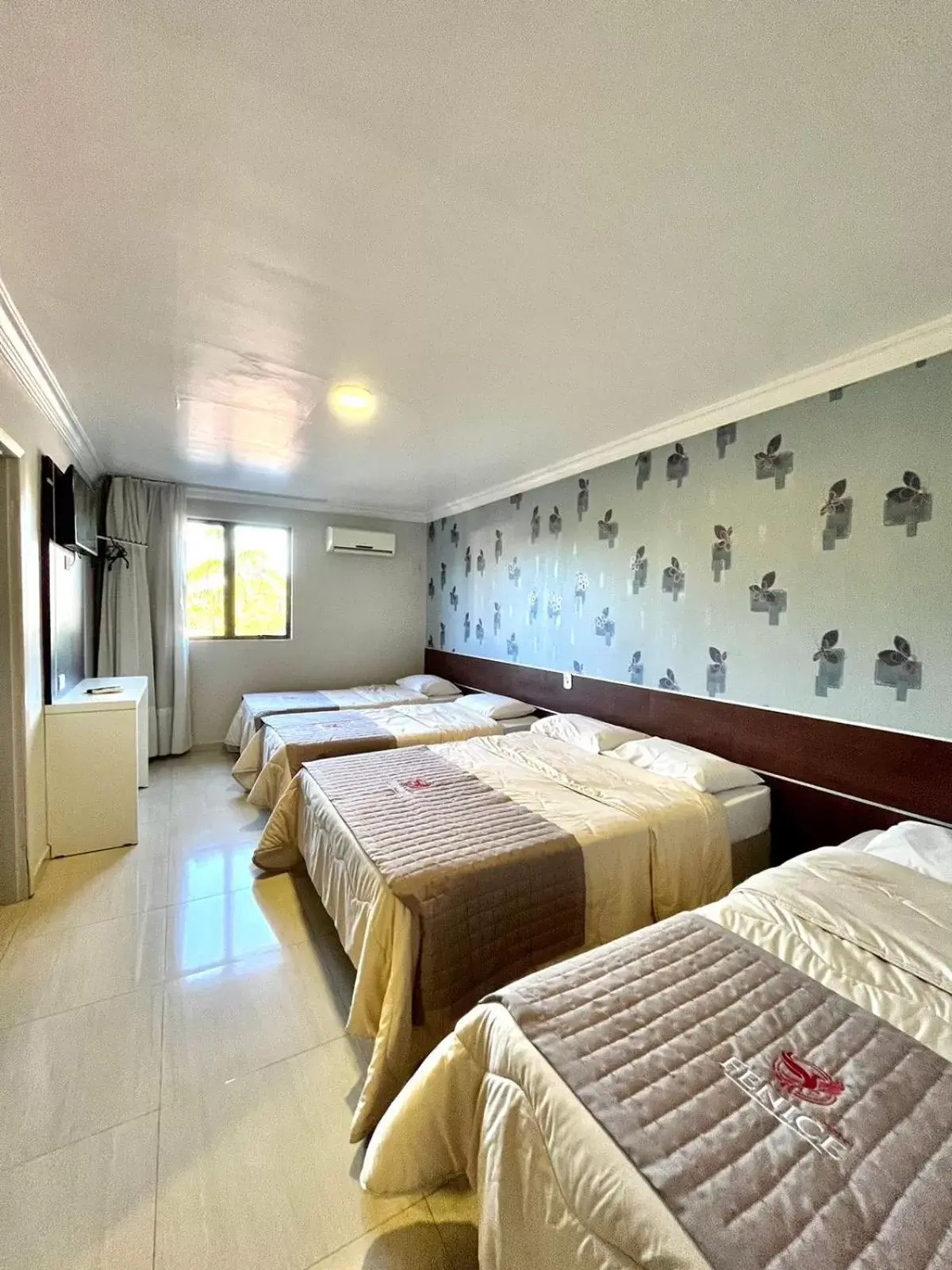 Quadruple Room in Hotel Fenice Quadruple Room in Hotel Fenice