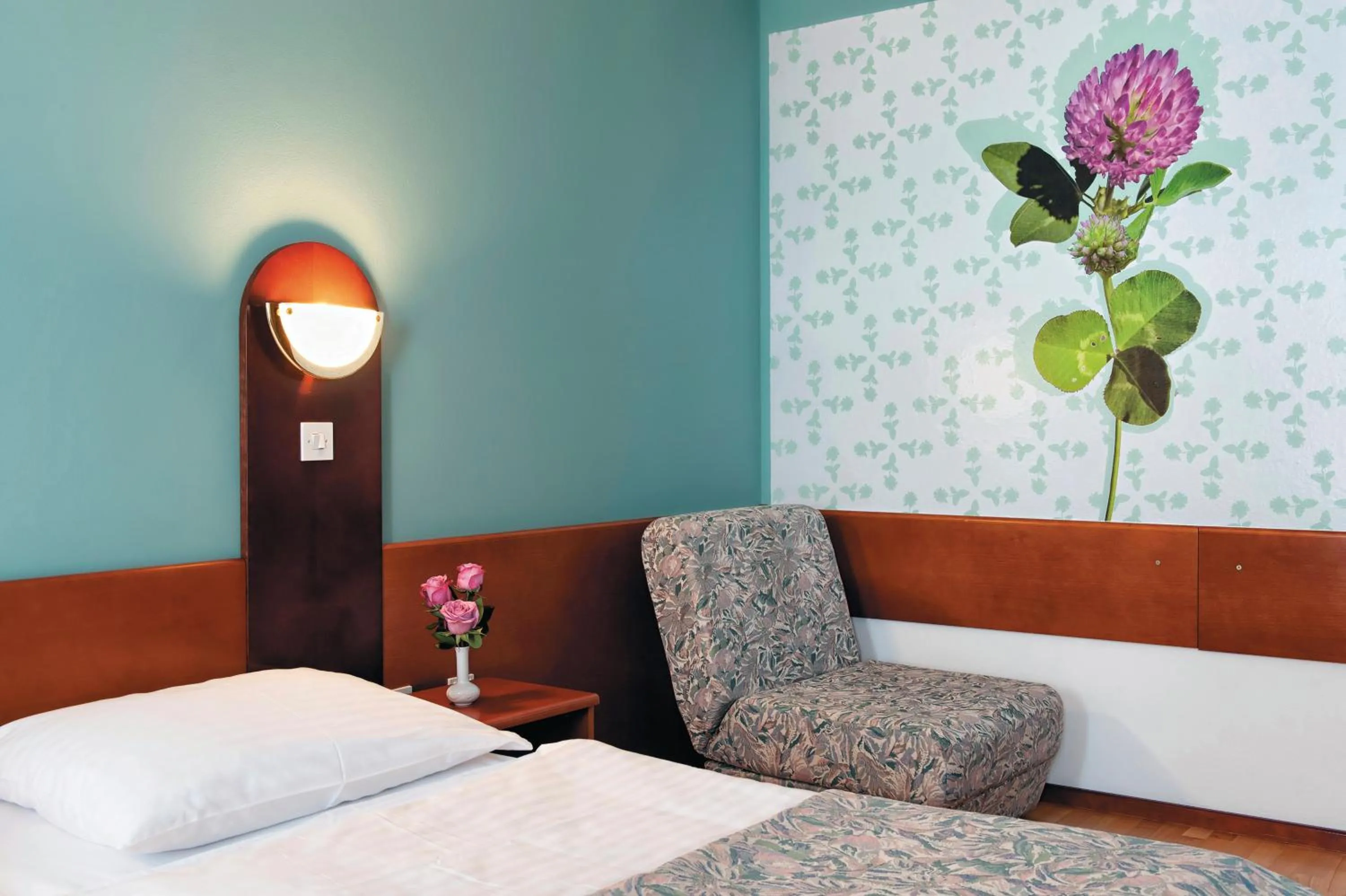 Bed in Hotel Tripič, restaurant and pizzeria