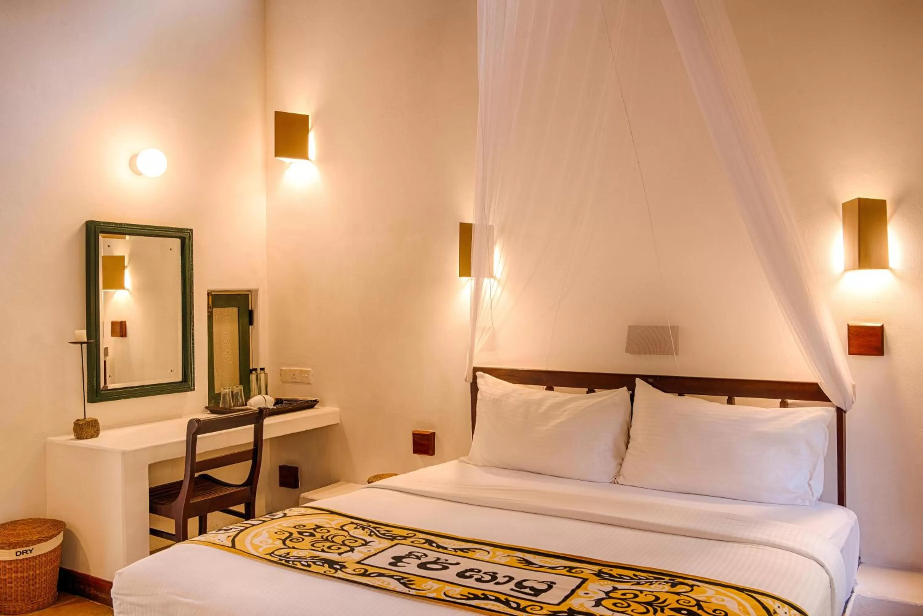 Seating area, Bed in Jetwing Ayurveda Pavilions