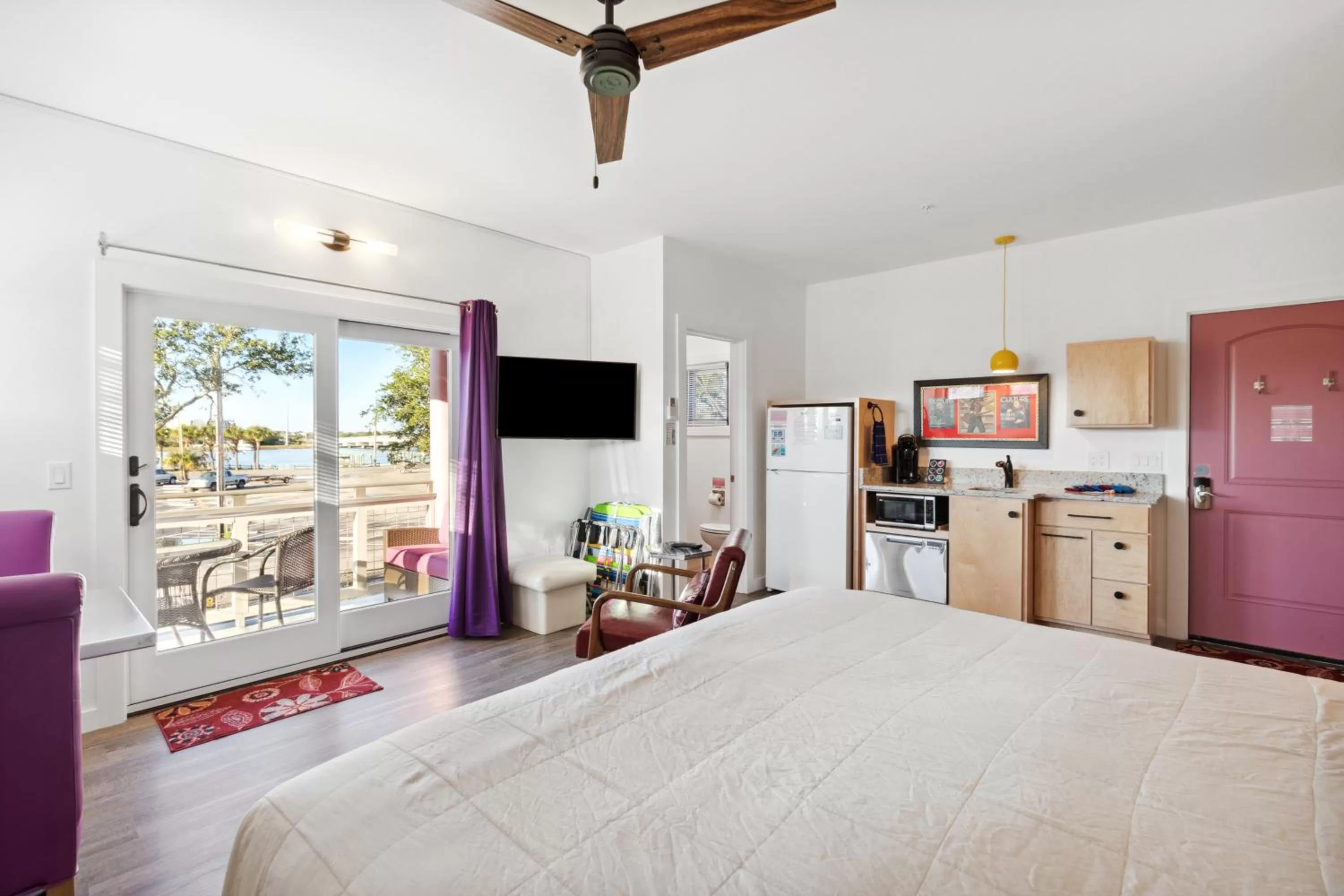 Bed in Hotel Folly with Marsh and Sunset Views