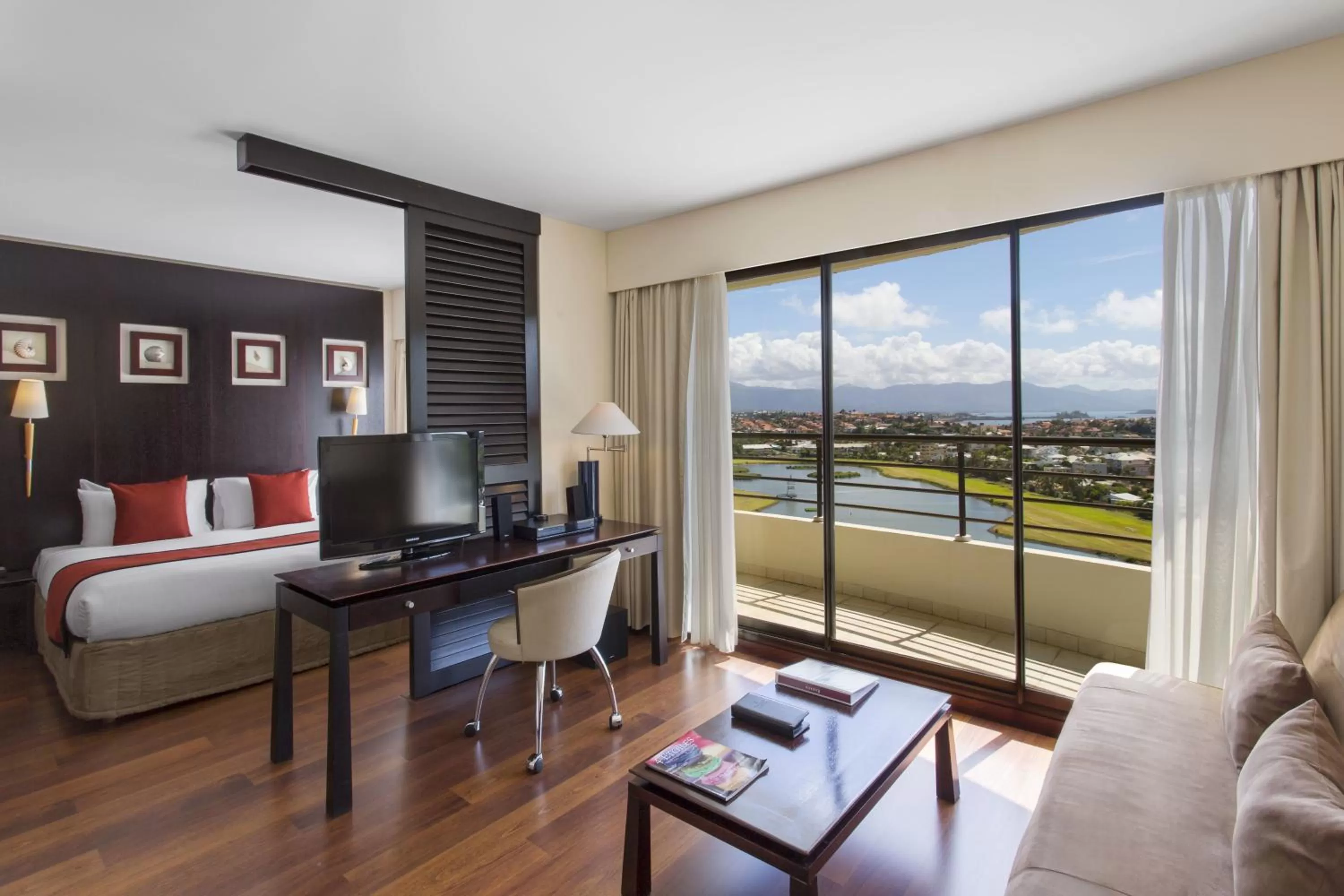 Photo of the whole room, Bed in Ramada Hotel & Suites by Wyndham Noumea