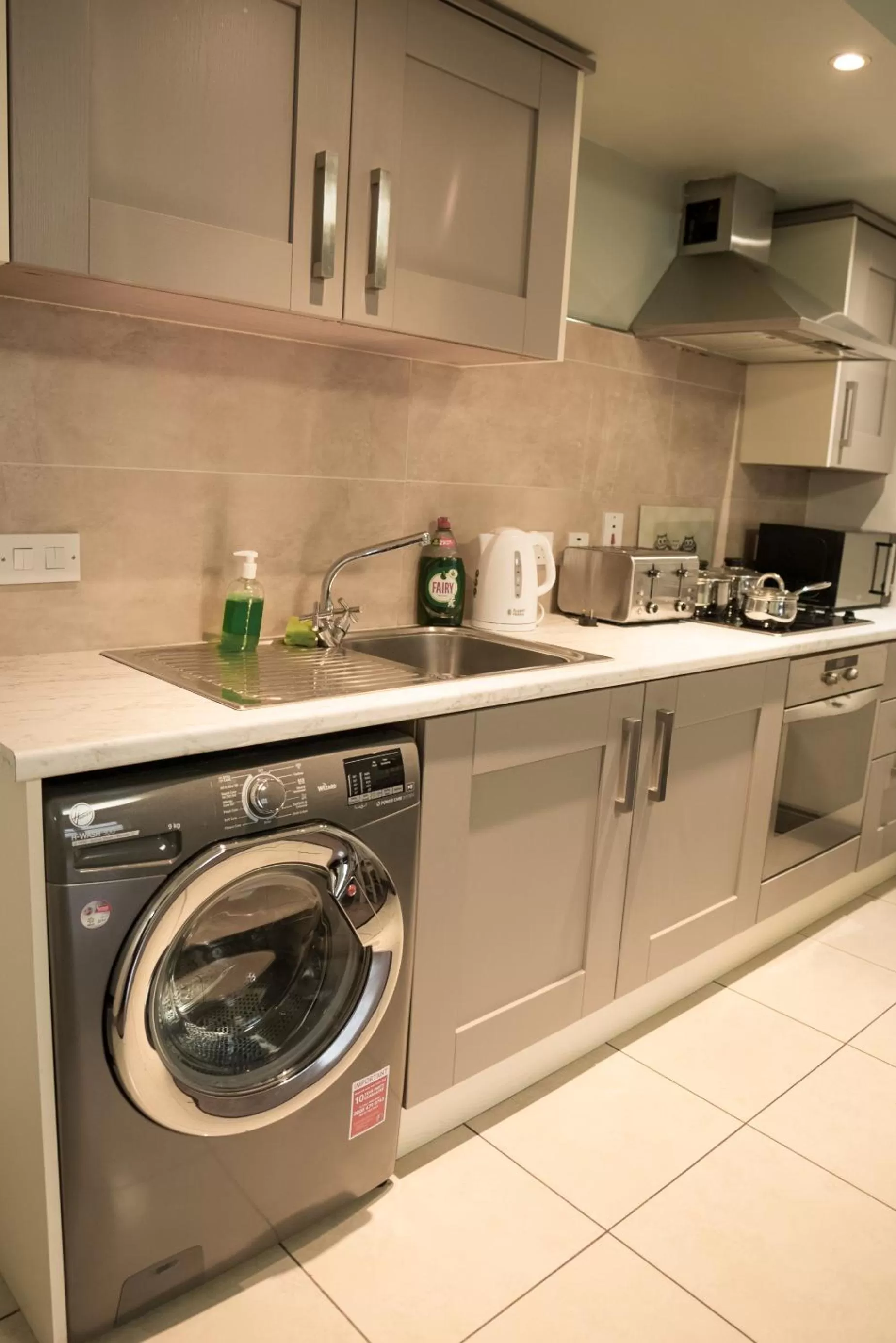 Kitchen or kitchenette in Walsh's Hotel and Apartments