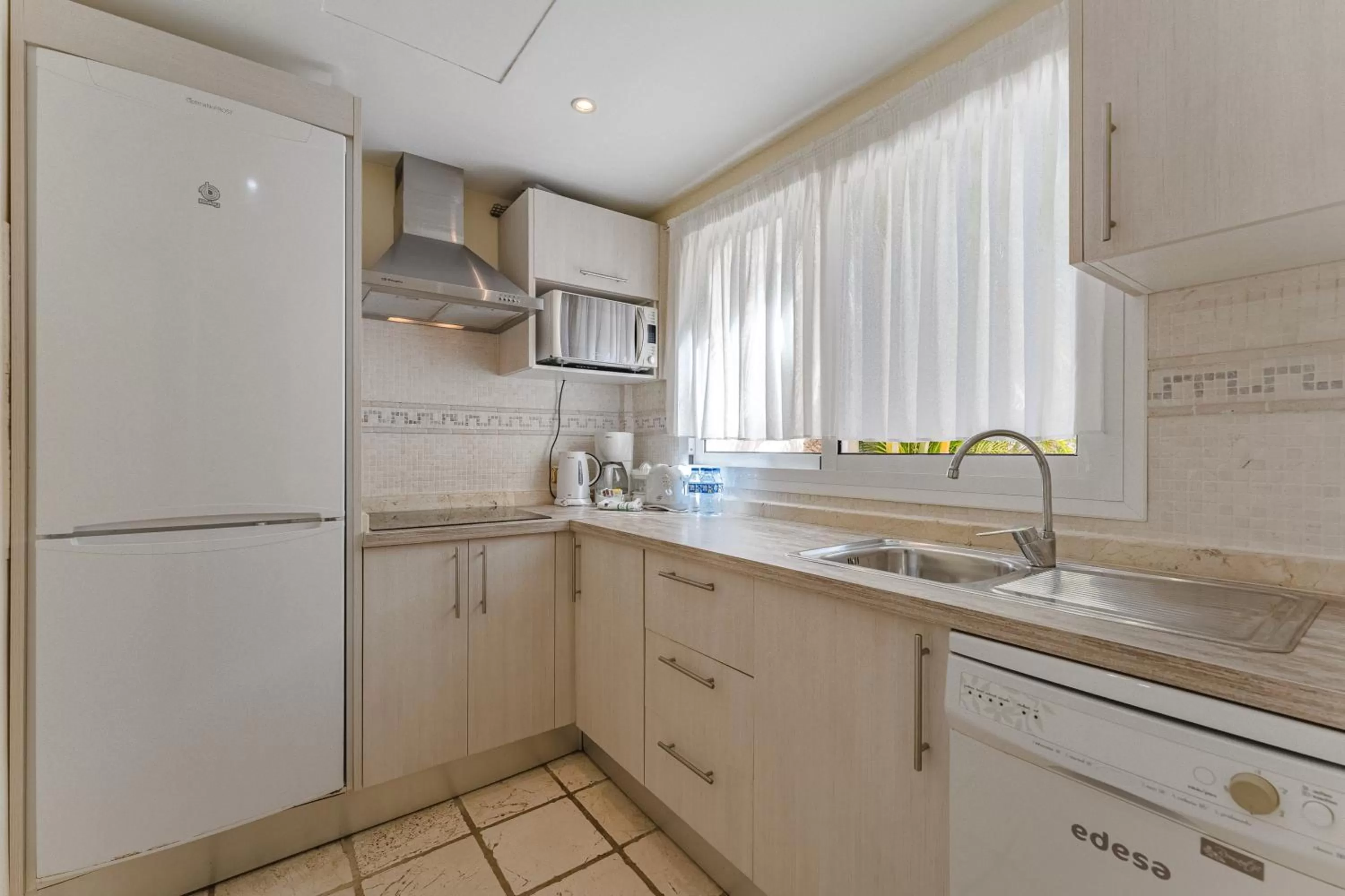 dishwasher in Flamingo Suites Boutique Hotel