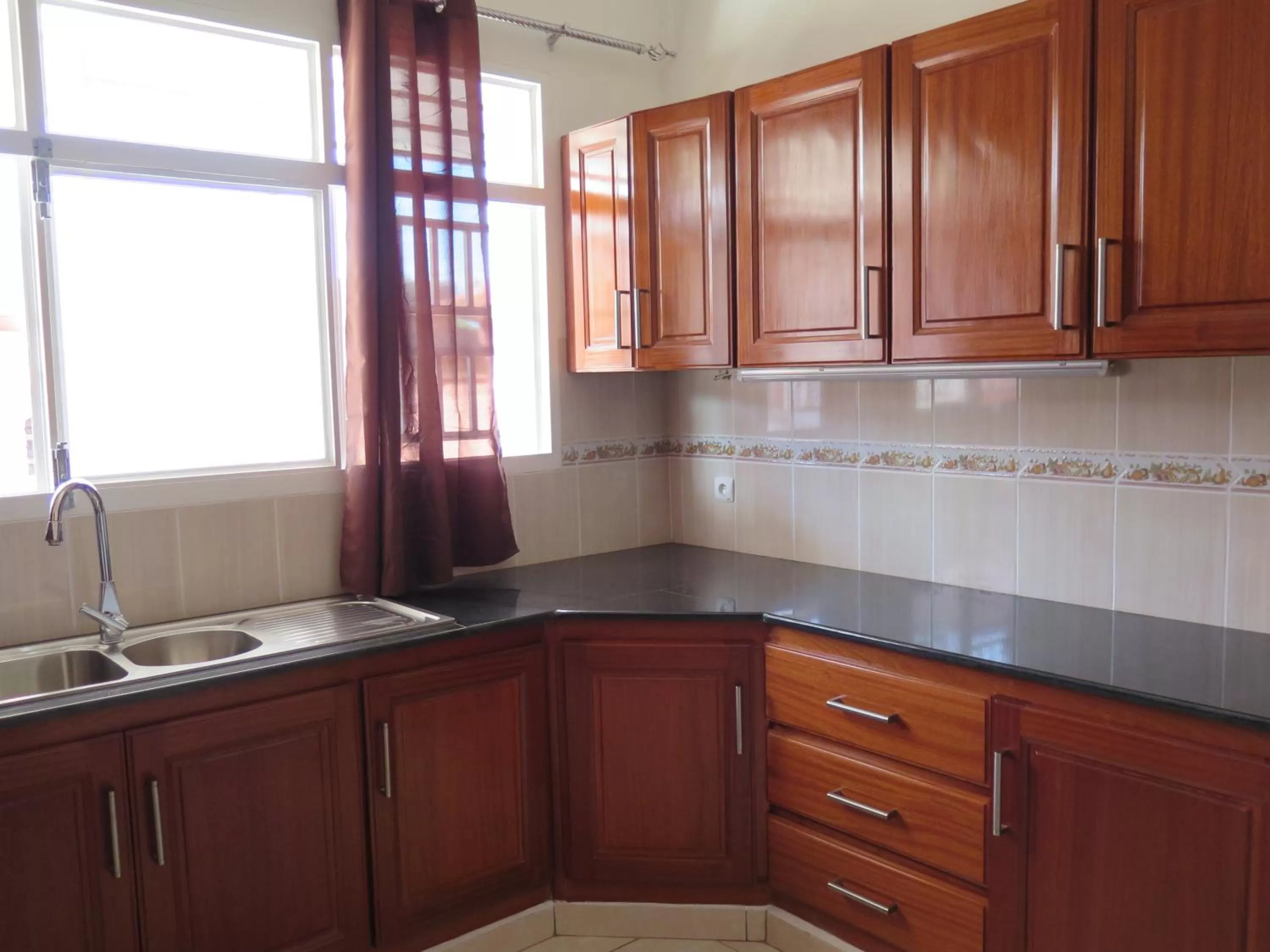 Kitchen or kitchenette in Hôtel Maisons-Sifa