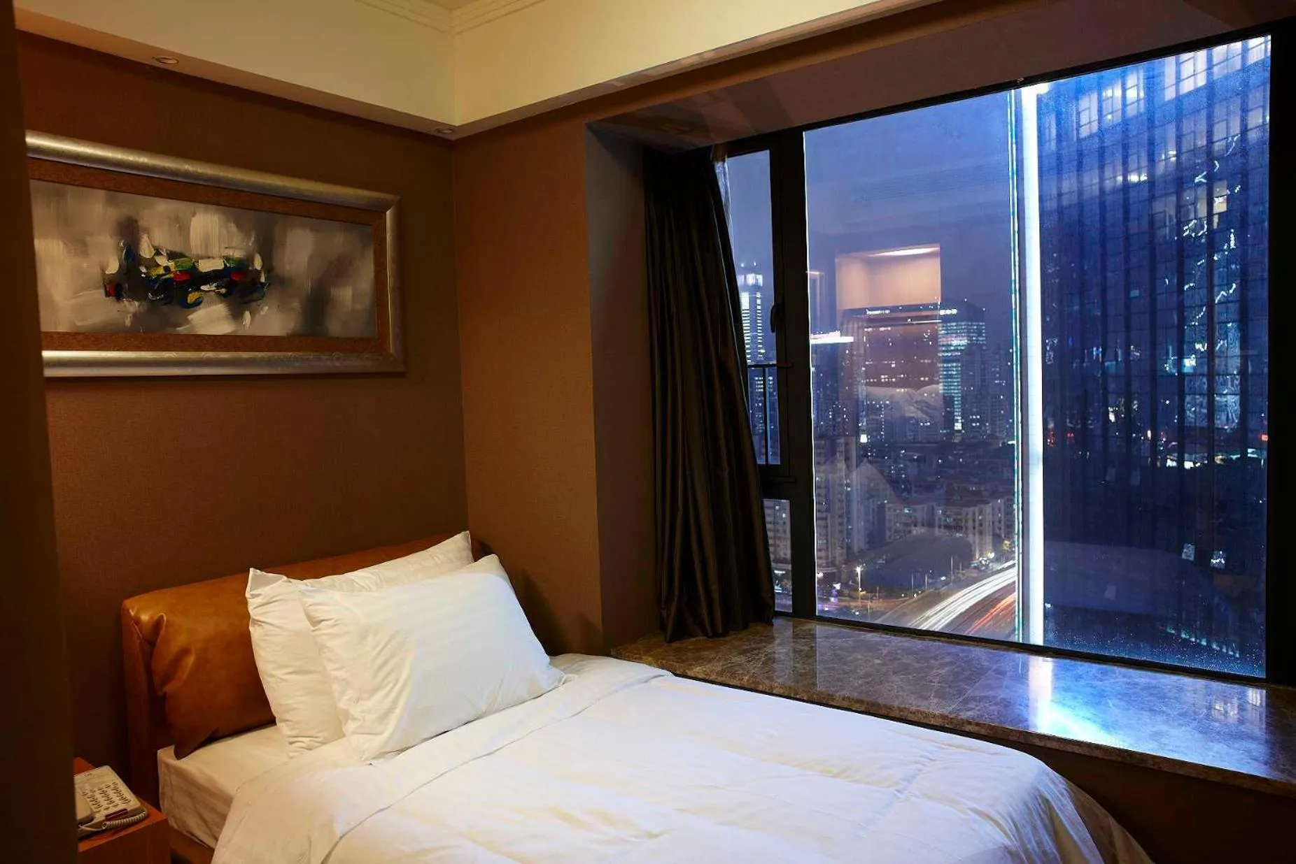 Bed in 广州丹顿行政公寓-Dan Executive Apartment Guangzhou Zhujiang New Town