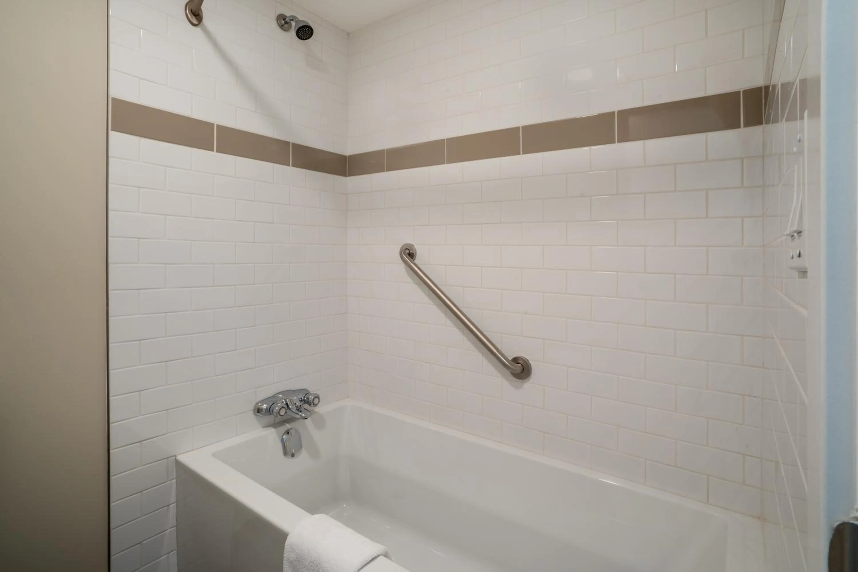 Shower in Thriftlodge by Wyndham Regina North