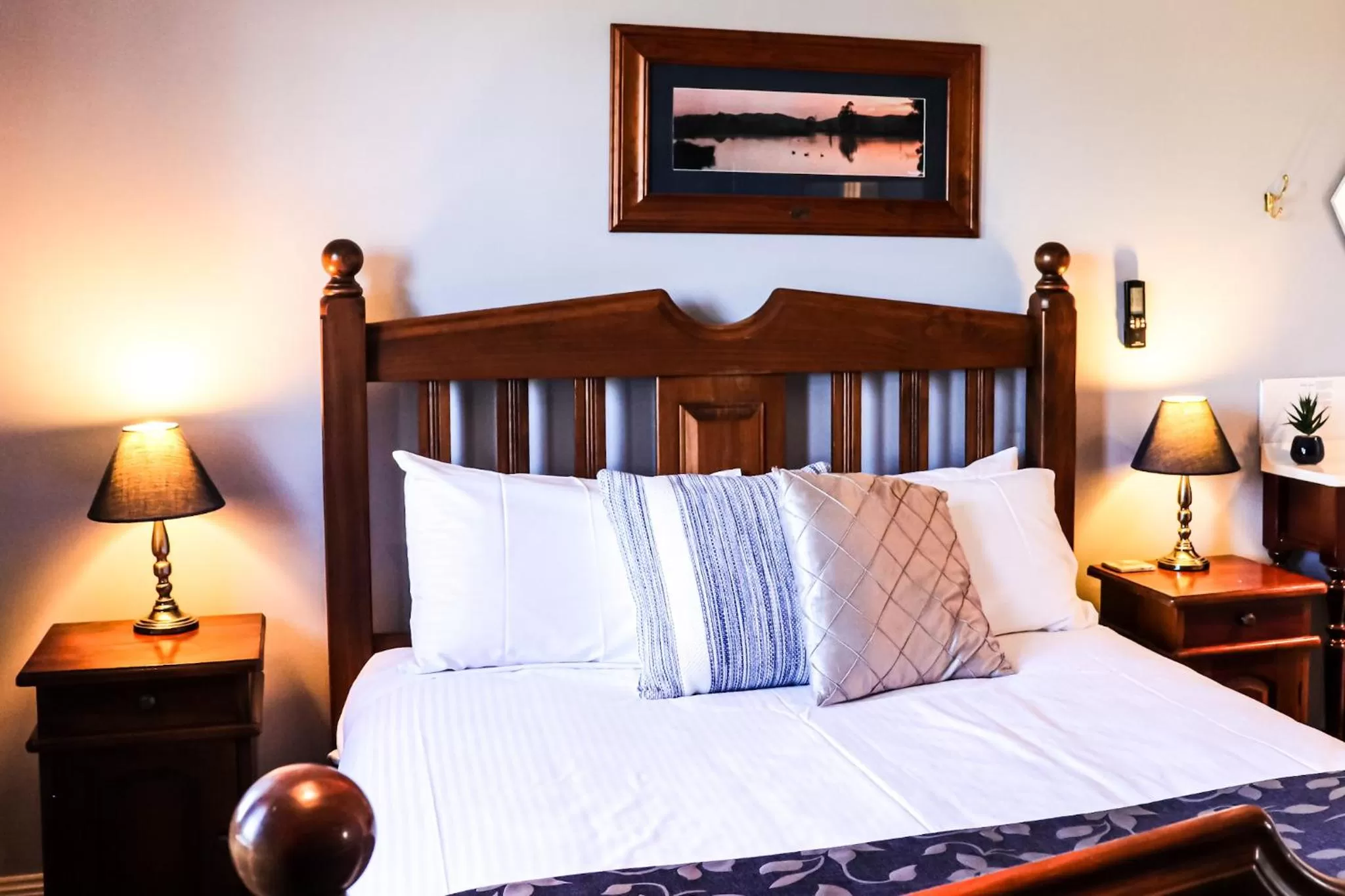 Bed in Plumes Boutique Bed & Breakfast