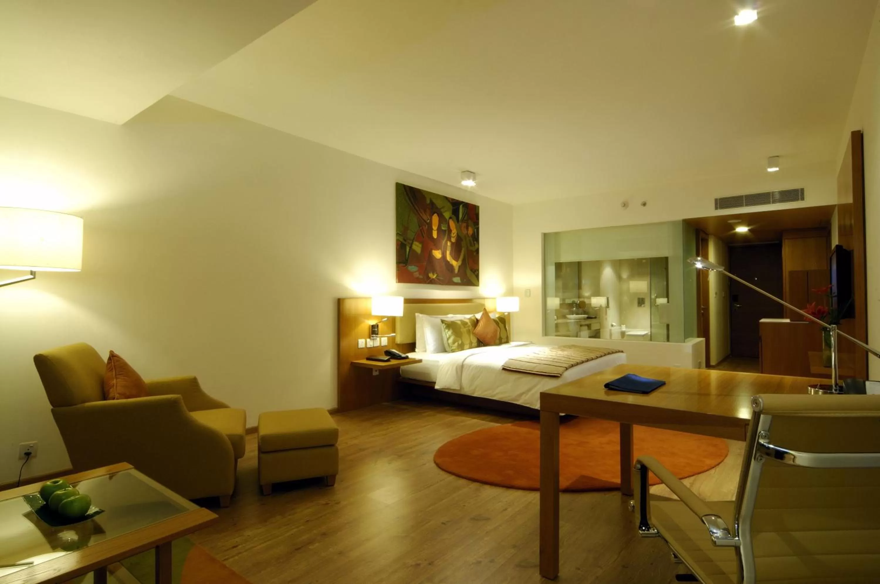 Seating area, Bed in Radisson Blu Plaza Hotel Hyderabad Banjara Hills