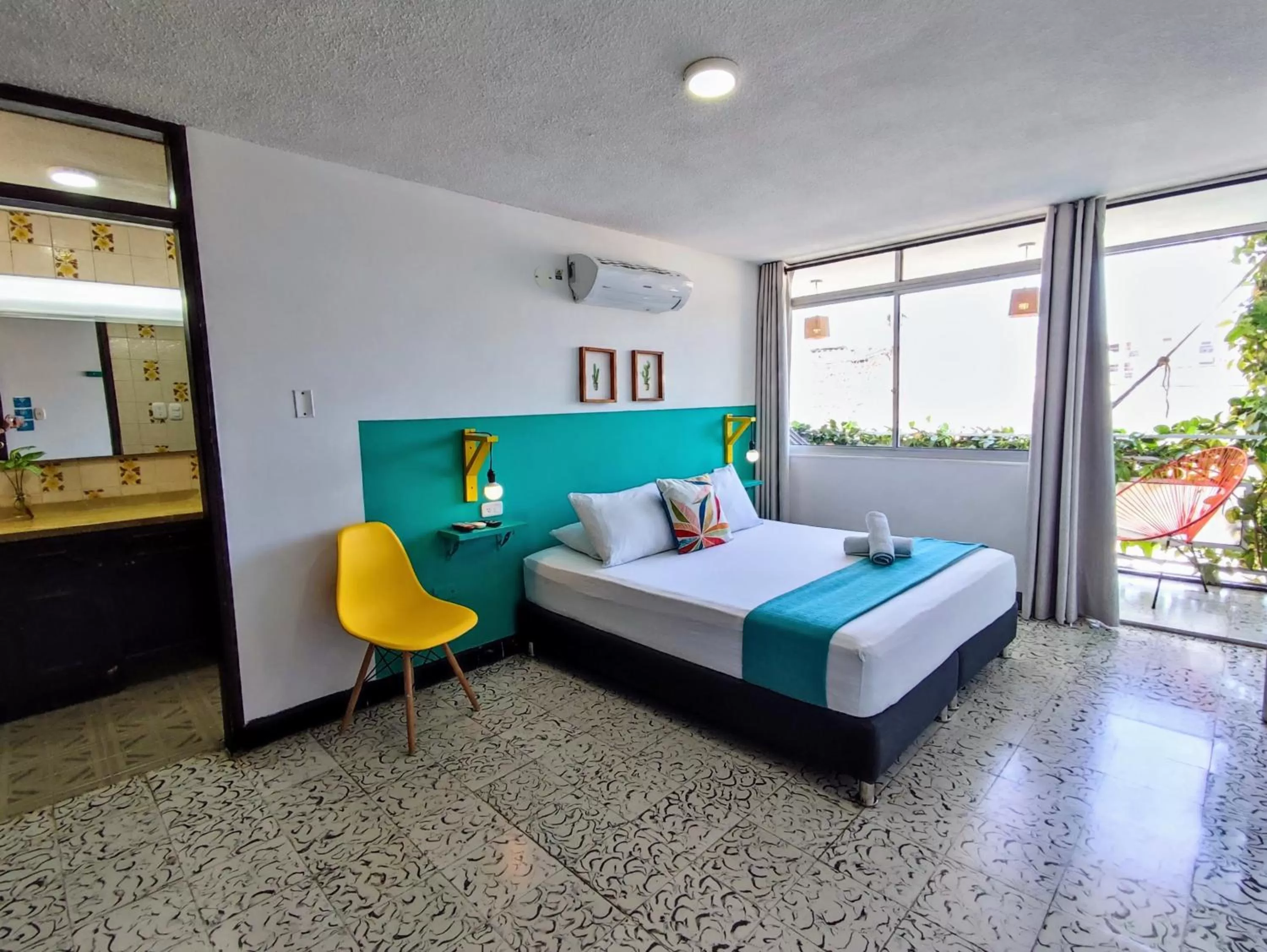 Bed in Bona Vida Hotel