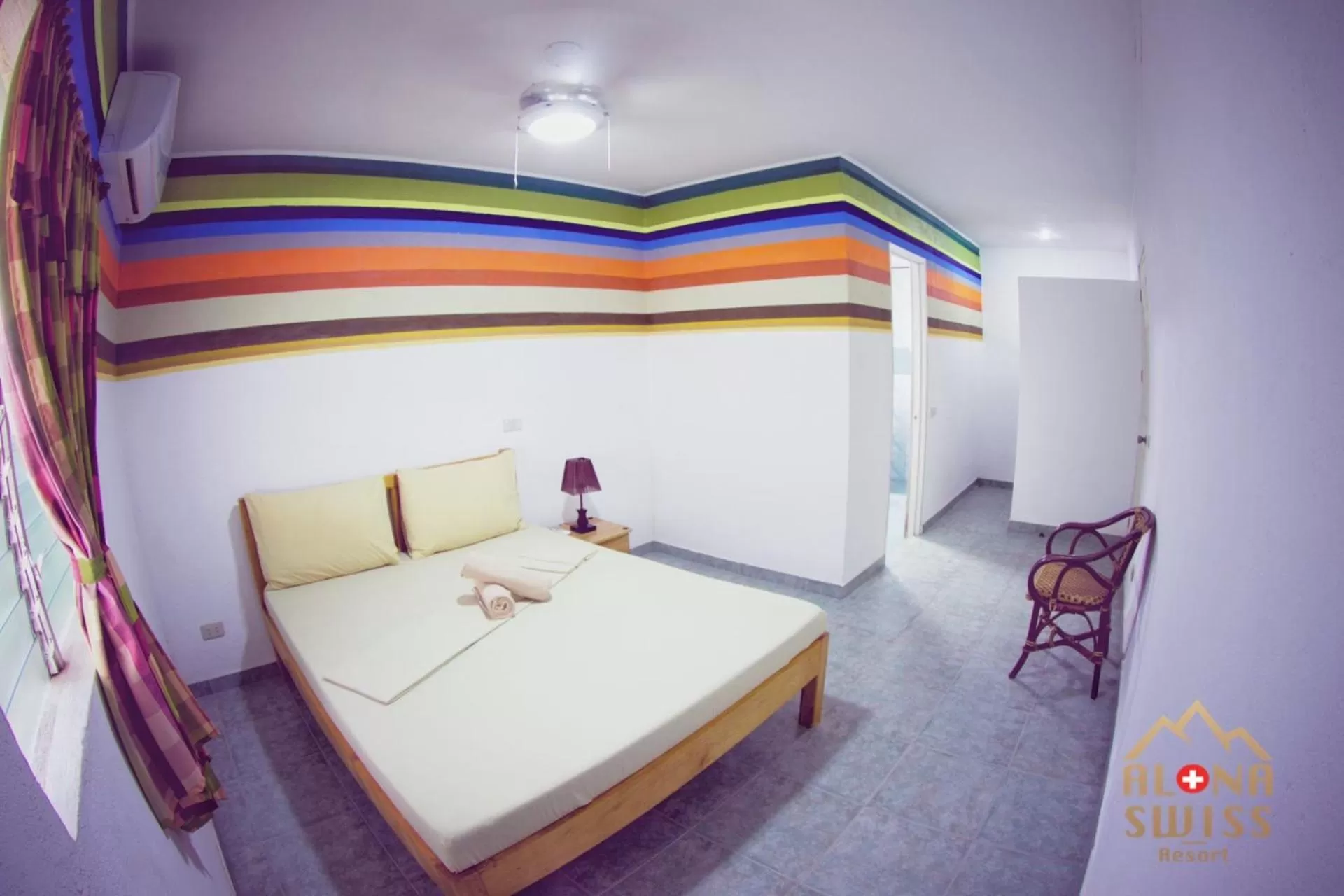 Bed in Alona Swiss Resort