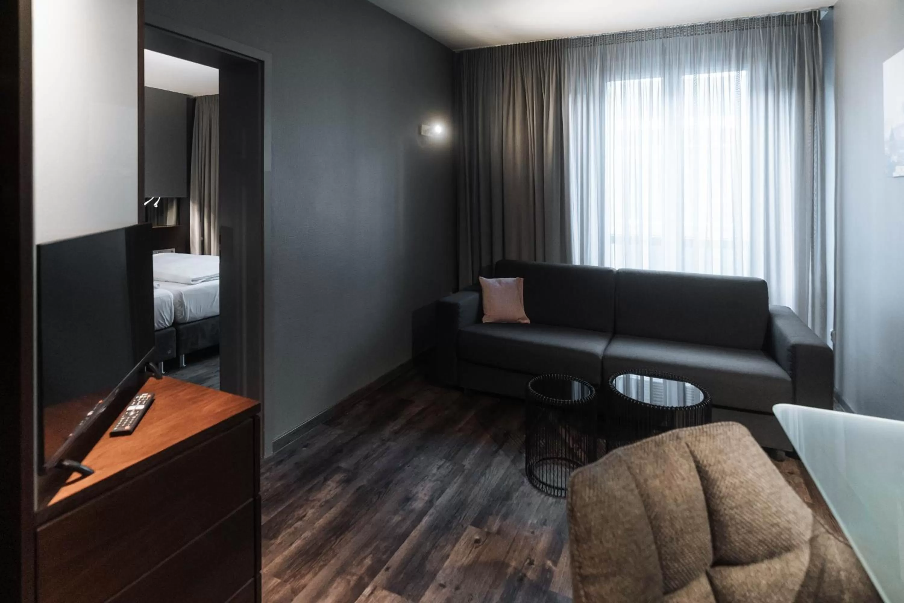 Communal lounge/ TV room in Hotel am Augustinerplatz