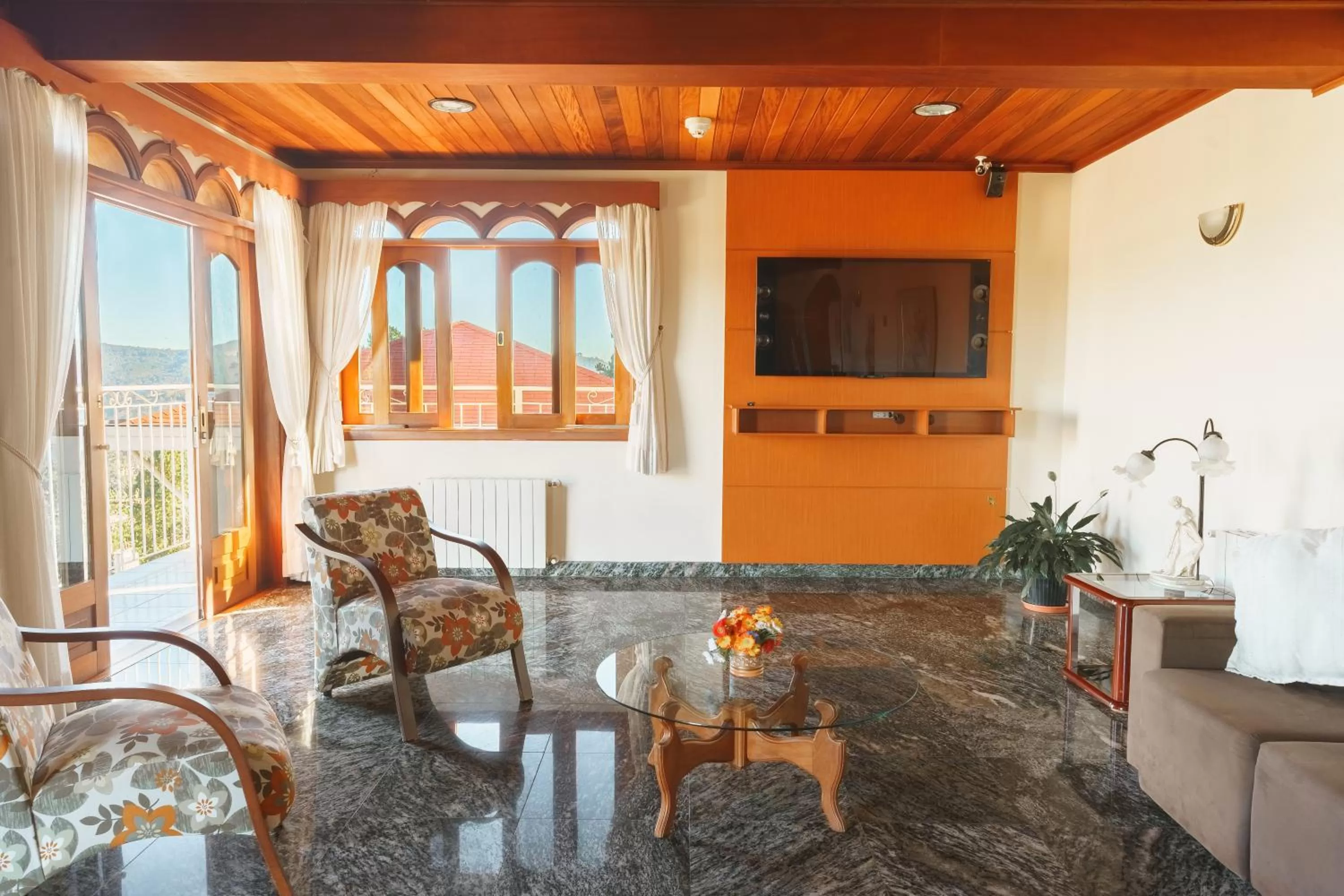 Communal lounge/ TV room in Pousada Recanto Almeida