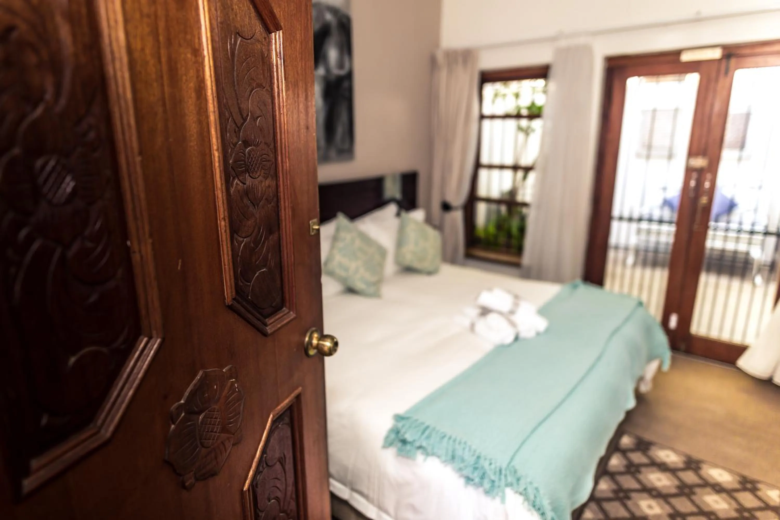 Bed in Point B Guest House -Sustainable Solar Energy