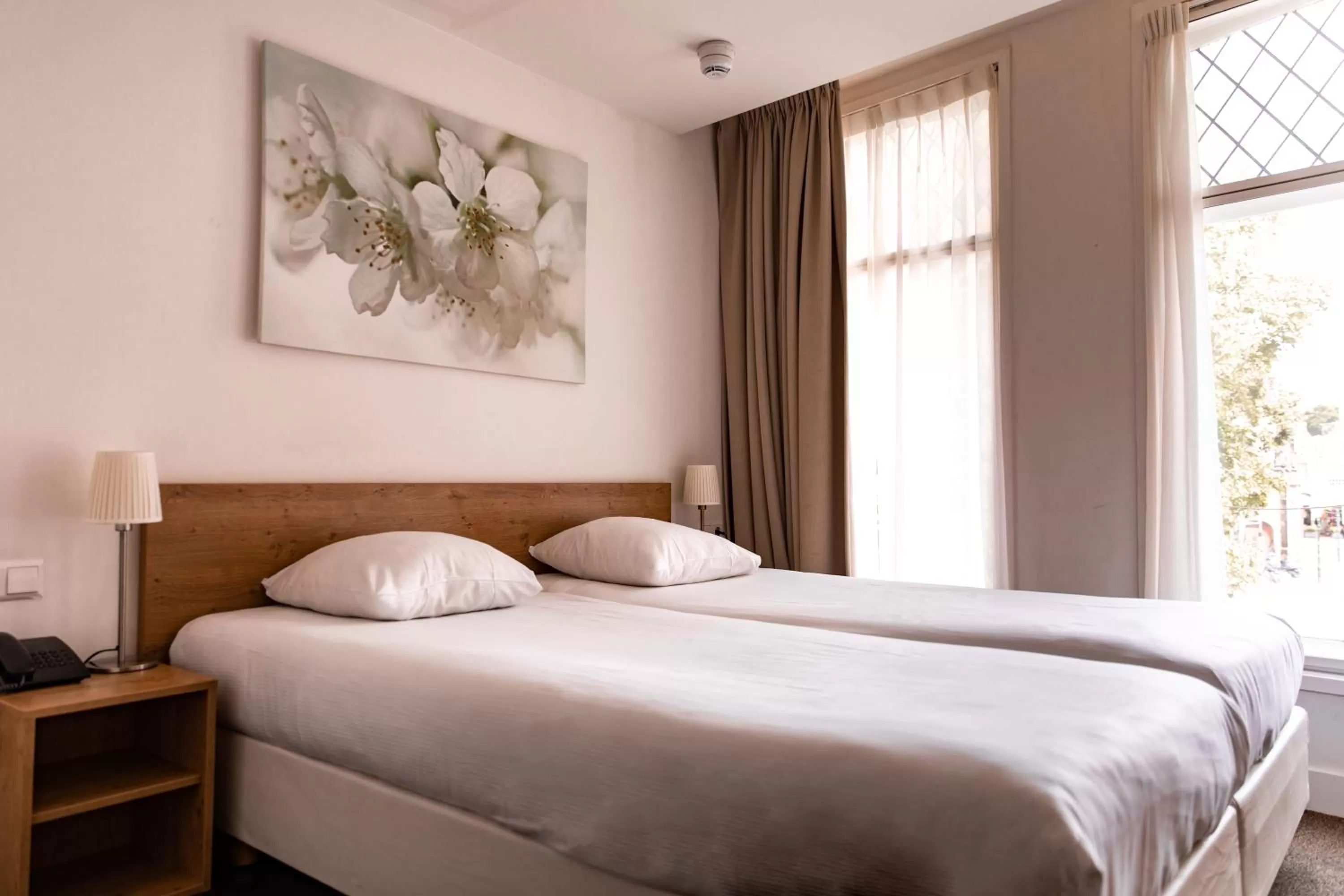 Bed in Ambassador City Centre Hotel