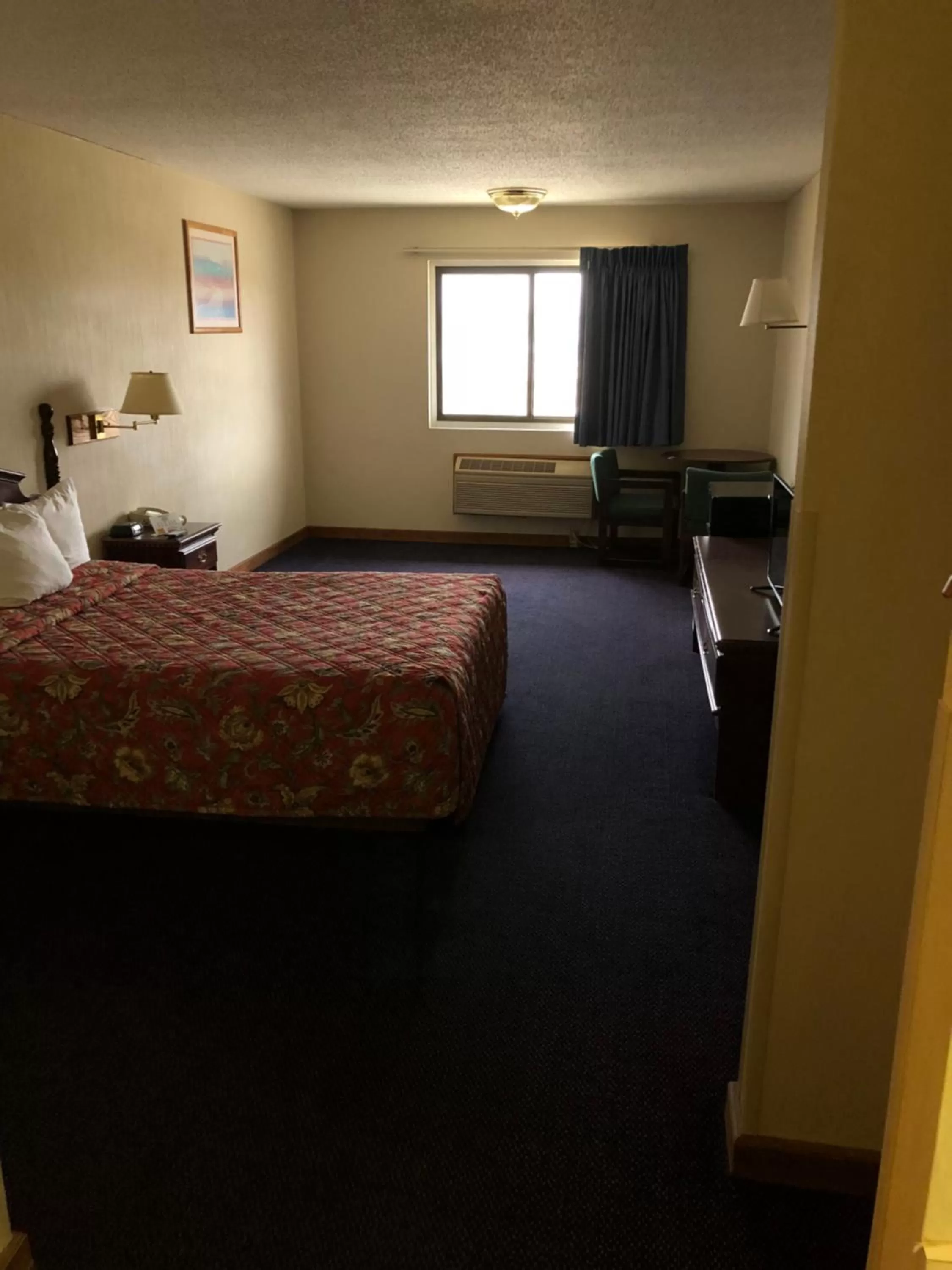 Bedroom in Denison Inn & Suites