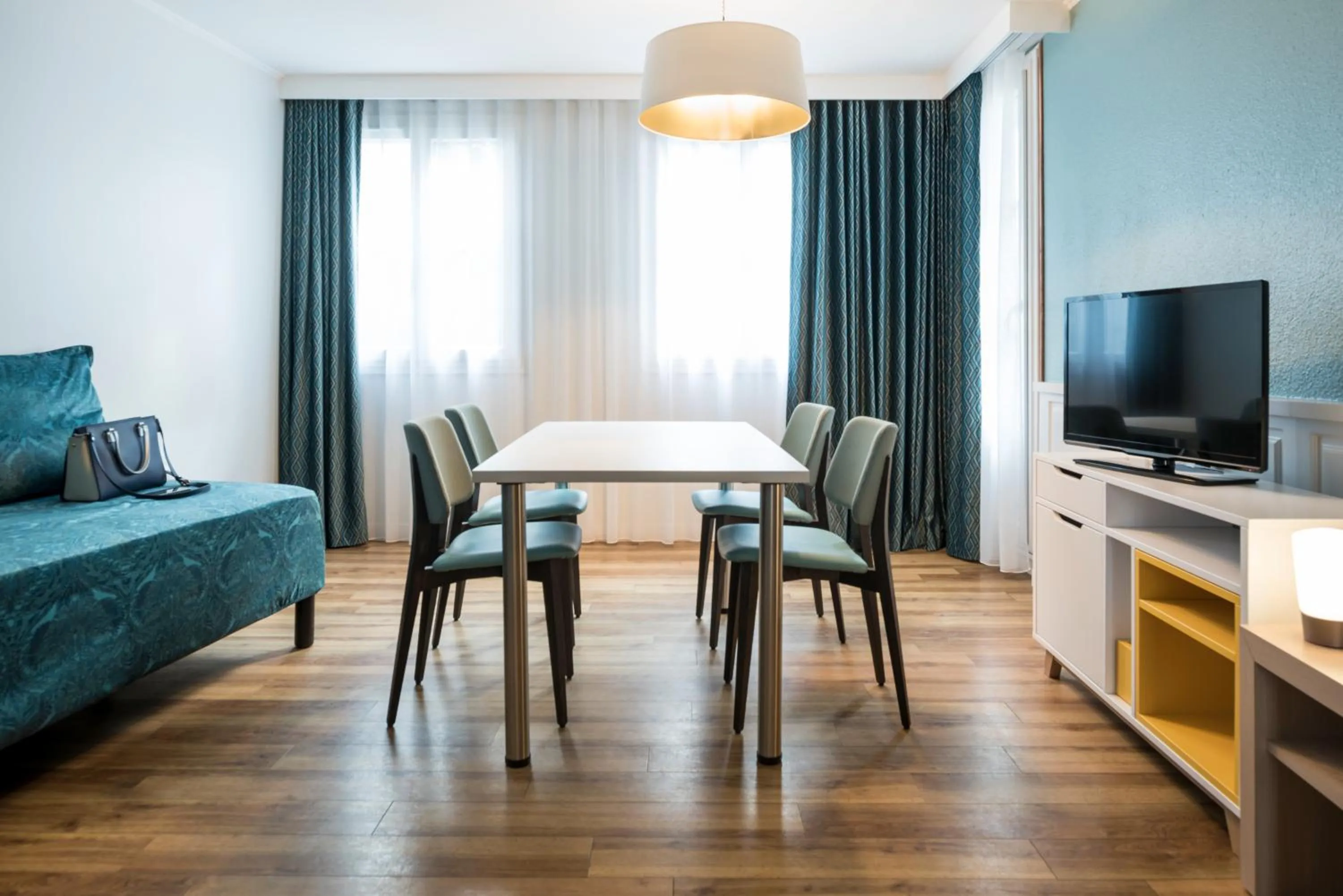 Living room, Bed in Aparthotel Adagio Paris Montmartre