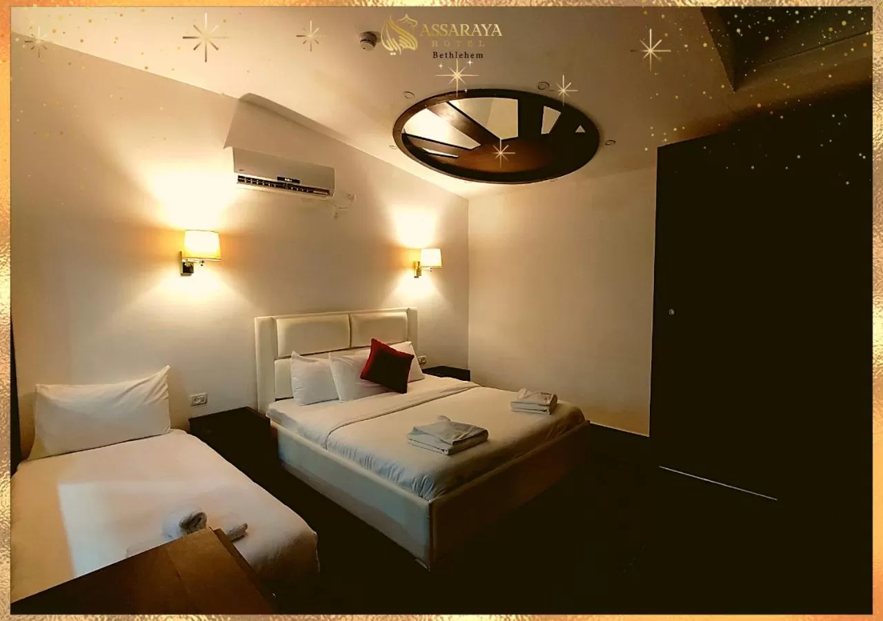 Bed in Assaraya Palace Hotel